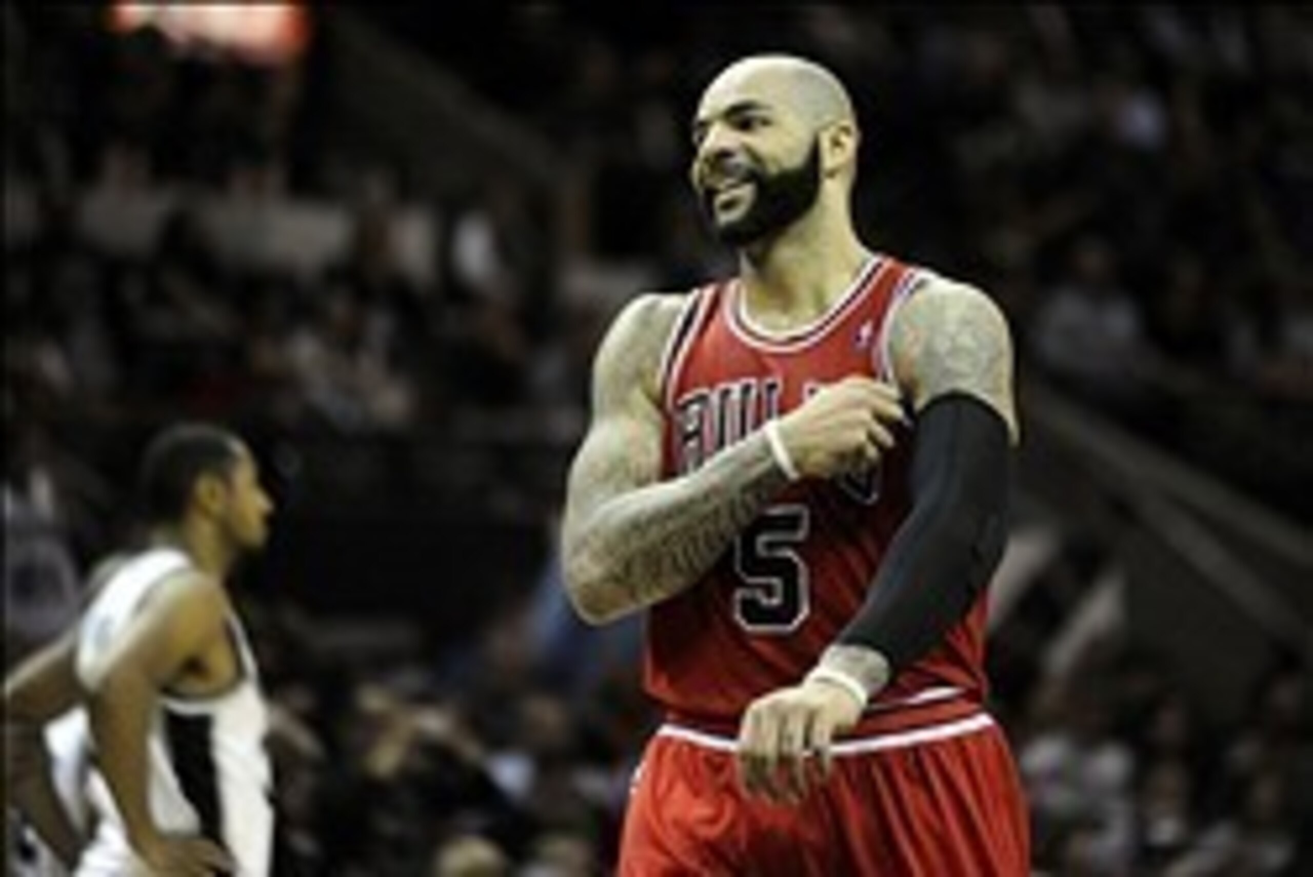 Jan 29, 2014; San Antonio, TX, USA; Chicago Bulls forward Carlos Boozer (5) reacts against the San Antonio Spurs during the second half at the AT&T Center. Chicago beat San Antonio 96-86. Mandatory Credit: Brendan Maloney-USA TODAY Sports