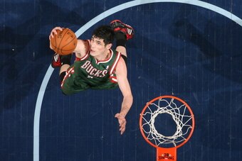 MEMPHIS, TN - FEBRUARY 1: Ersan Ilyasova #7 of the Milwaukee Bucks rebounds against the Memphis Grizzlies on February 1, 2014 at FedExForum in Memphis, Tennessee. NOTE TO USER: User expressly acknowledges and agrees that, by downloading and or using this 