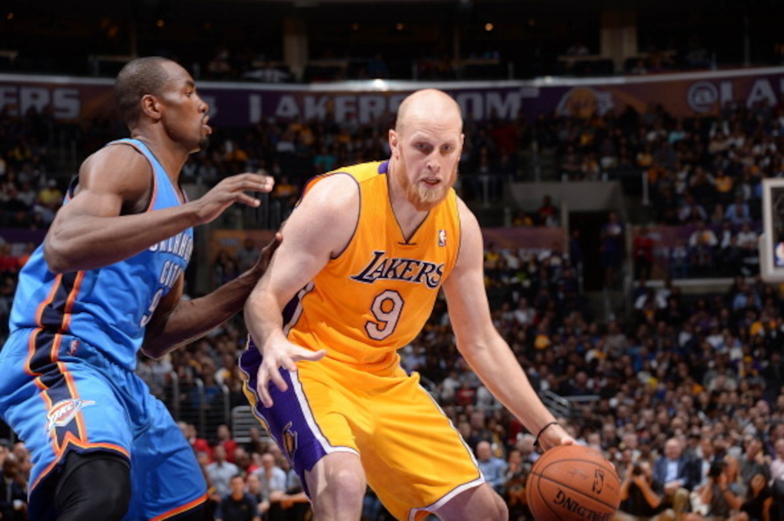 LOS ANGELES, CA - FEBRUARY 13: Chris Kaman #9 of the Los Angeles Lakers handles the ball against Serge Ibaka #9 of the Oklahoma City Thunder at Staples Center on February 13, 2014 in Los Angeles, California. NOTE TO USER: User expressly acknowledges and a