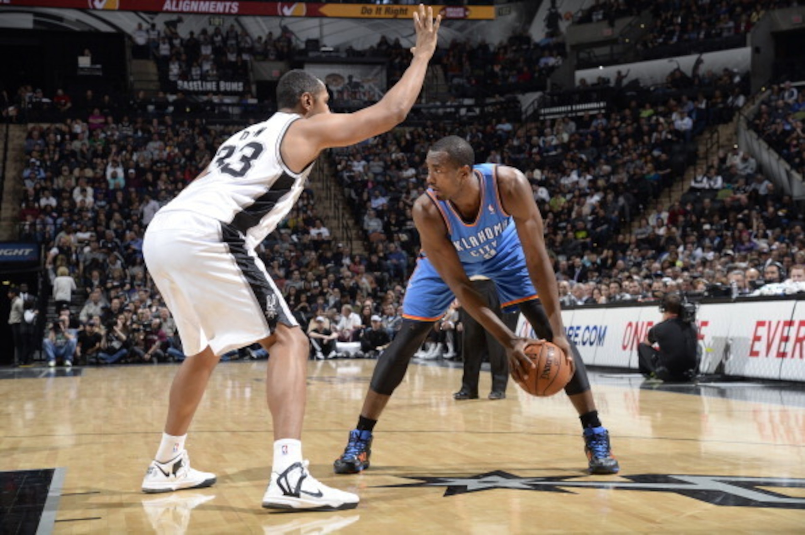 SAN ANTONIO, TX - January 22: Serge Ibaka #9 of the Oklahoma City Thunder controls the ball against the San Antonio Spurs at the AT&T Center on January 22, 2014 in San Antonio, Texas. NOTE TO USER: User expressly acknowledges and agrees that, by downloadi