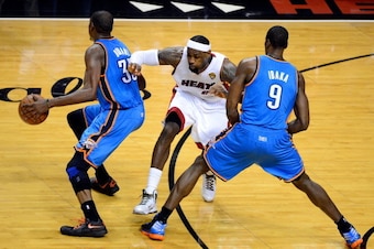 MIAMI, FL - JUNE 19:  Kevin Durant #35 of the Oklahoma City Thunder attempts to drive around a pick set by teammates Serge Ibaka #9 against LeBron James #6 of the Miami Heat in Game Four of the 2012 NBA Finals on June 19, 2012 at American Airlines Arena i