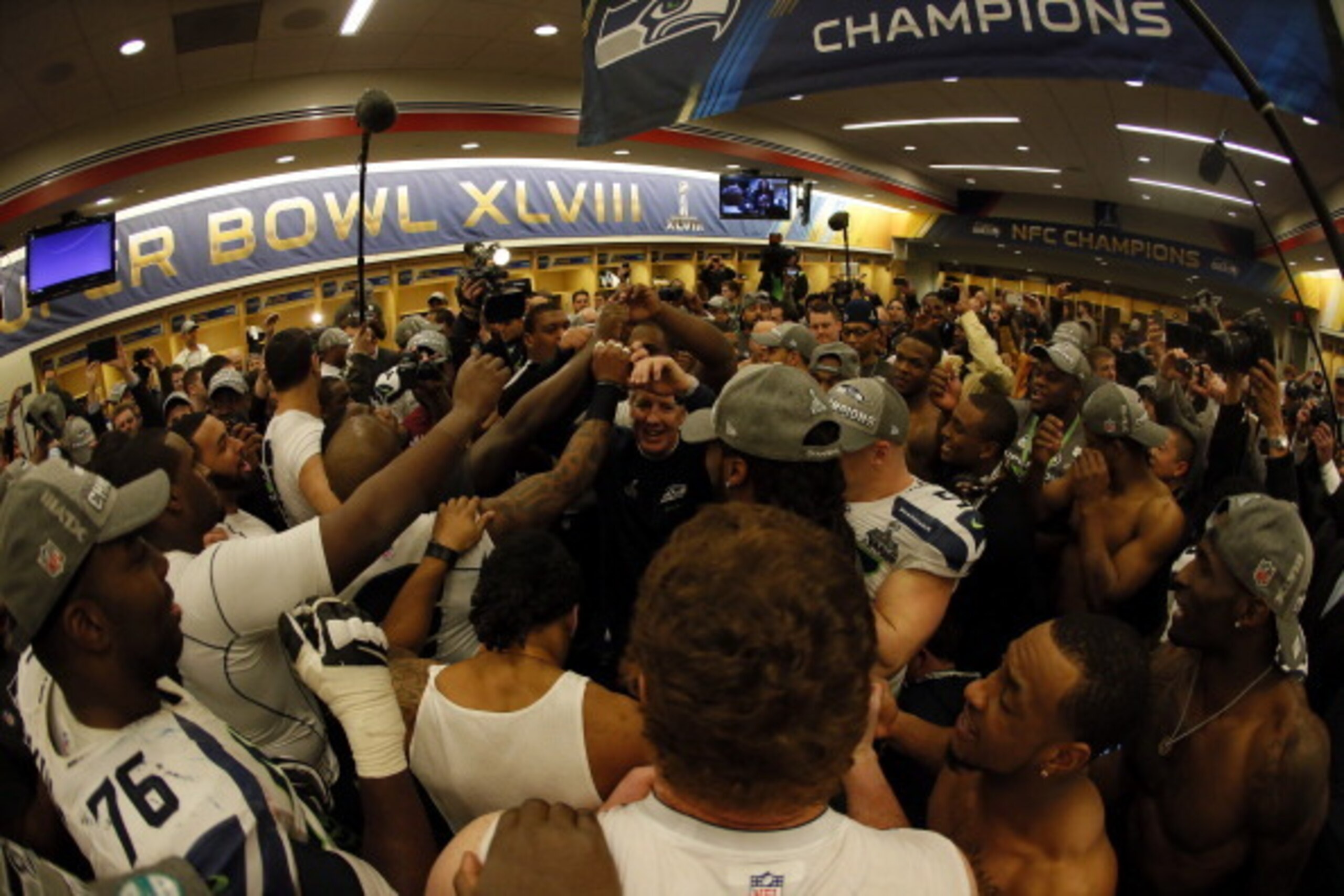 EAST RUTHERFORD, NJ - FEBRUARY 02:  Head coach Pete Carroll of the Seattle Seahawks gives his team a speech in the locker room after the Seahawks 43-8 victory during Super Bowl XLVIII at MetLife Stadium on February 2, 2014 in East Rutherford, New Jersey. 