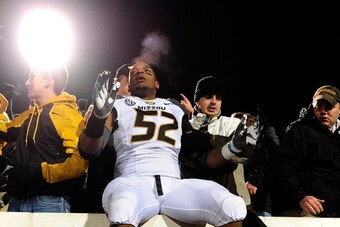 OXFORD, MS - NOVEMBER 23:  Michael Sam #52 of the Missouri Tigers celebrates with fans following a victory over the Ole Miss Rebels at Vaught-Hemingway Stadium on November 23, 2013 in Oxford, Mississippi.  Missouri won the game 24-10.  (Photo by Stacy Rev