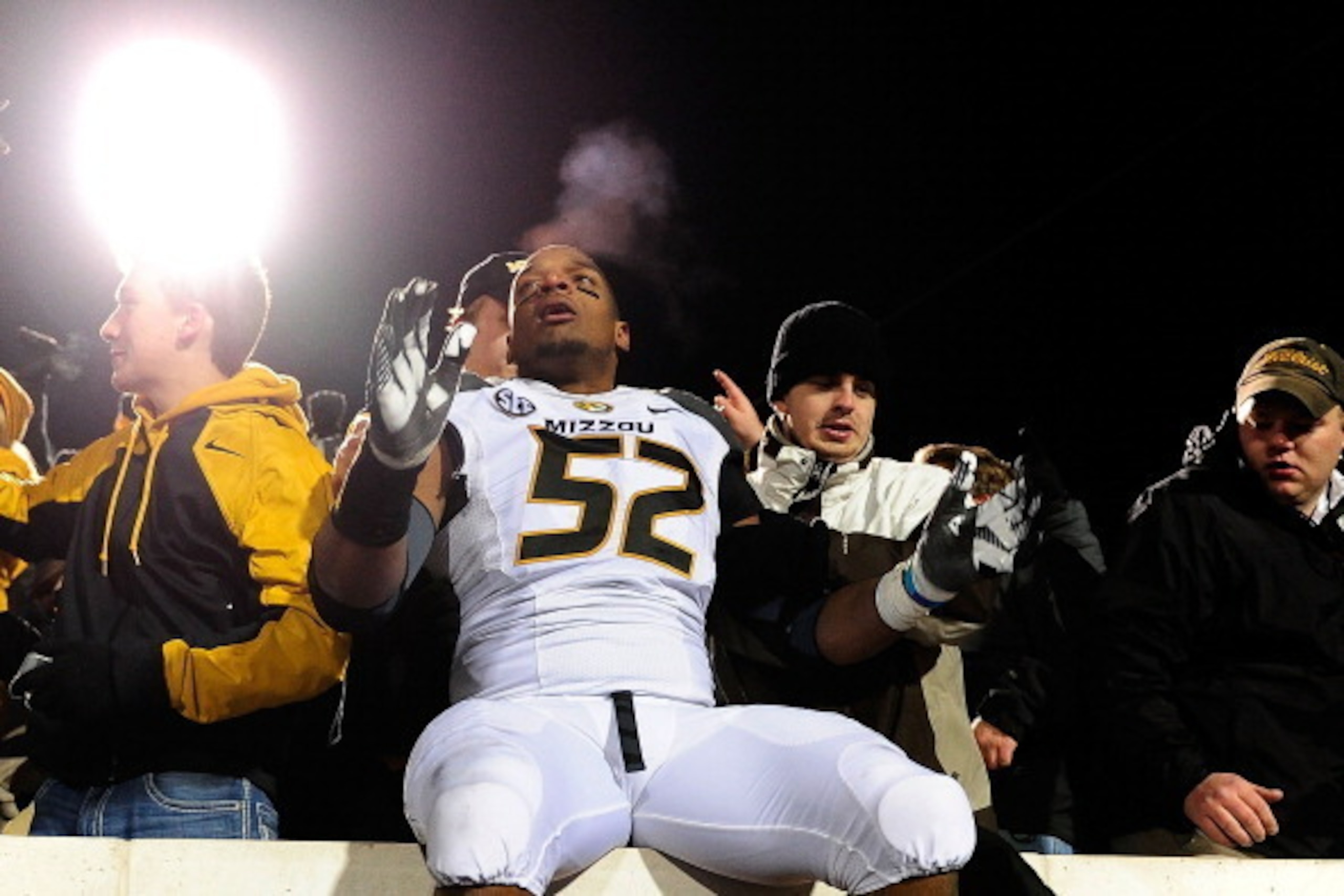 OXFORD, MS - NOVEMBER 23:  Michael Sam #52 of the Missouri Tigers celebrates with fans following a victory over the Ole Miss Rebels at Vaught-Hemingway Stadium on November 23, 2013 in Oxford, Mississippi.  Missouri won the game 24-10.  (Photo by Stacy Rev