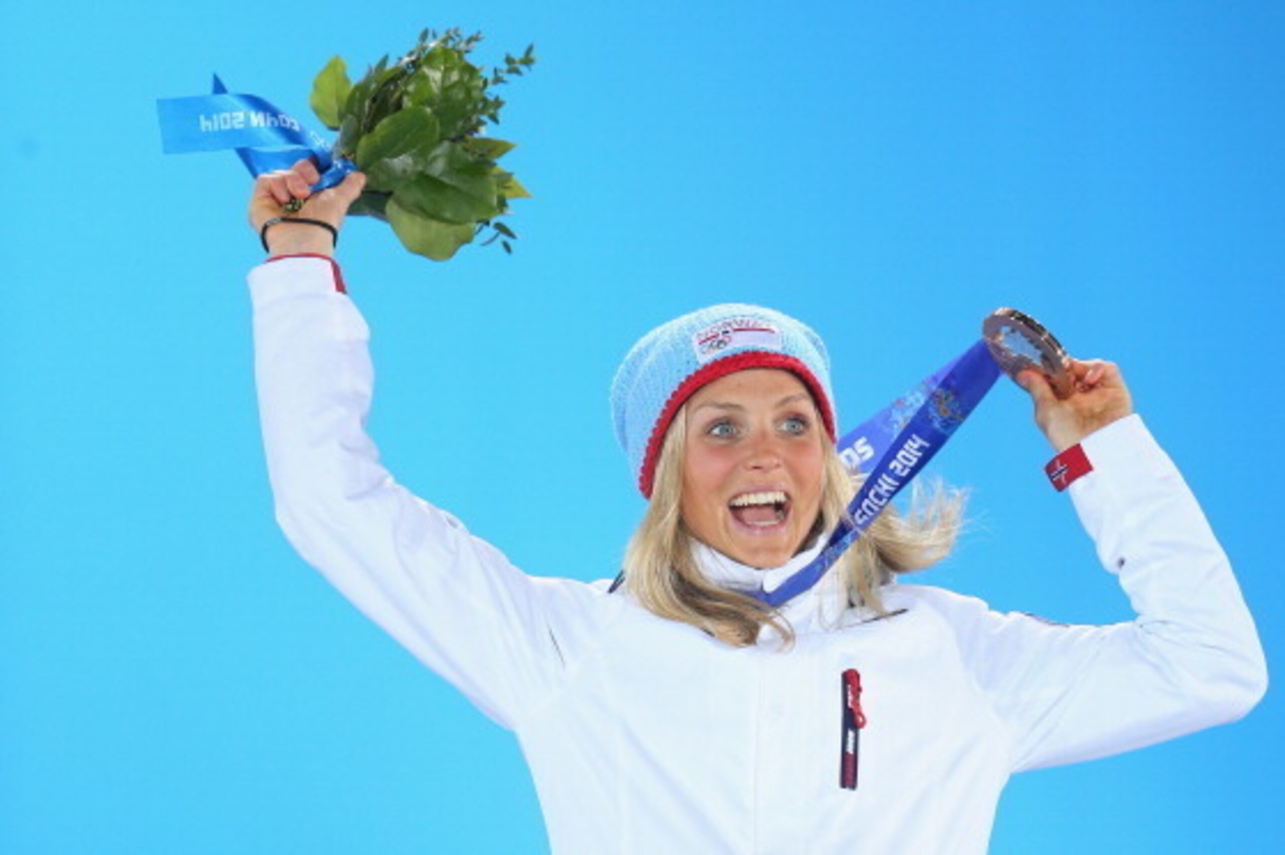 SOCHI, RUSSIA - FEBRUARY 13:  Bronze medalist Therese Johaug of Norway celebrates during the medal ceremony for the Women's 10 km Classic on day six of the Sochi 2014 Winter Olympics at Medals Plaza on February 13, 2014 in Sochi, Russia.  (Photo by Quinn 
