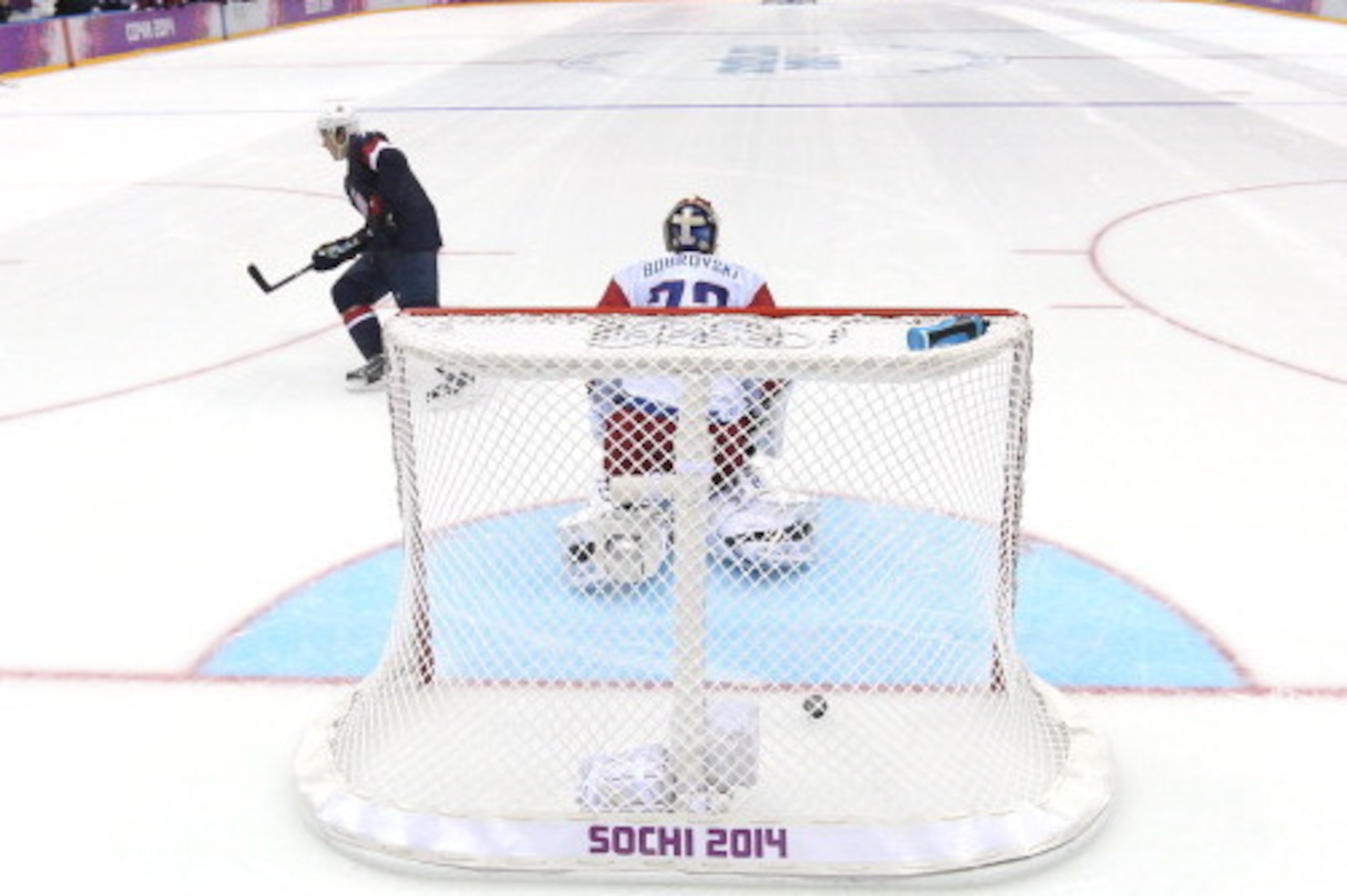 SOCHI, RUSSIA - FEBRUARY 15:  T.J. Oshie #74 of the United States scores on a shootout against Sergei Bobrovski #72 of Russia during the Men's Ice Hockey Preliminary Round Group A game on day eight of the Sochi 2014 Winter Olympics at Bolshoy Ice Dome on 