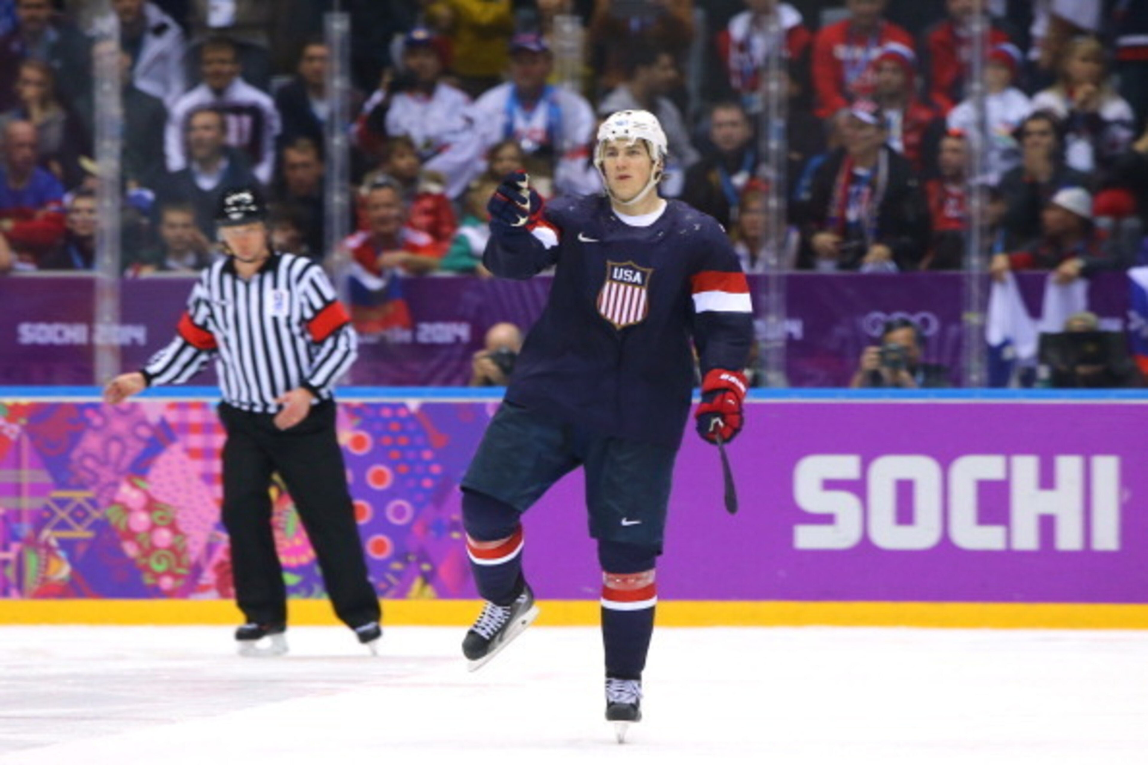 SOCHI, RUSSIA - FEBRUARY 15:  T.J. Oshie #74 of the United States celebrates after scoring on a shootout against Sergei Bobrovski #72 of Russia to win the Men's Ice Hockey Preliminary Round Group A game on day eight of the Sochi 2014 Winter Olympics at Bo
