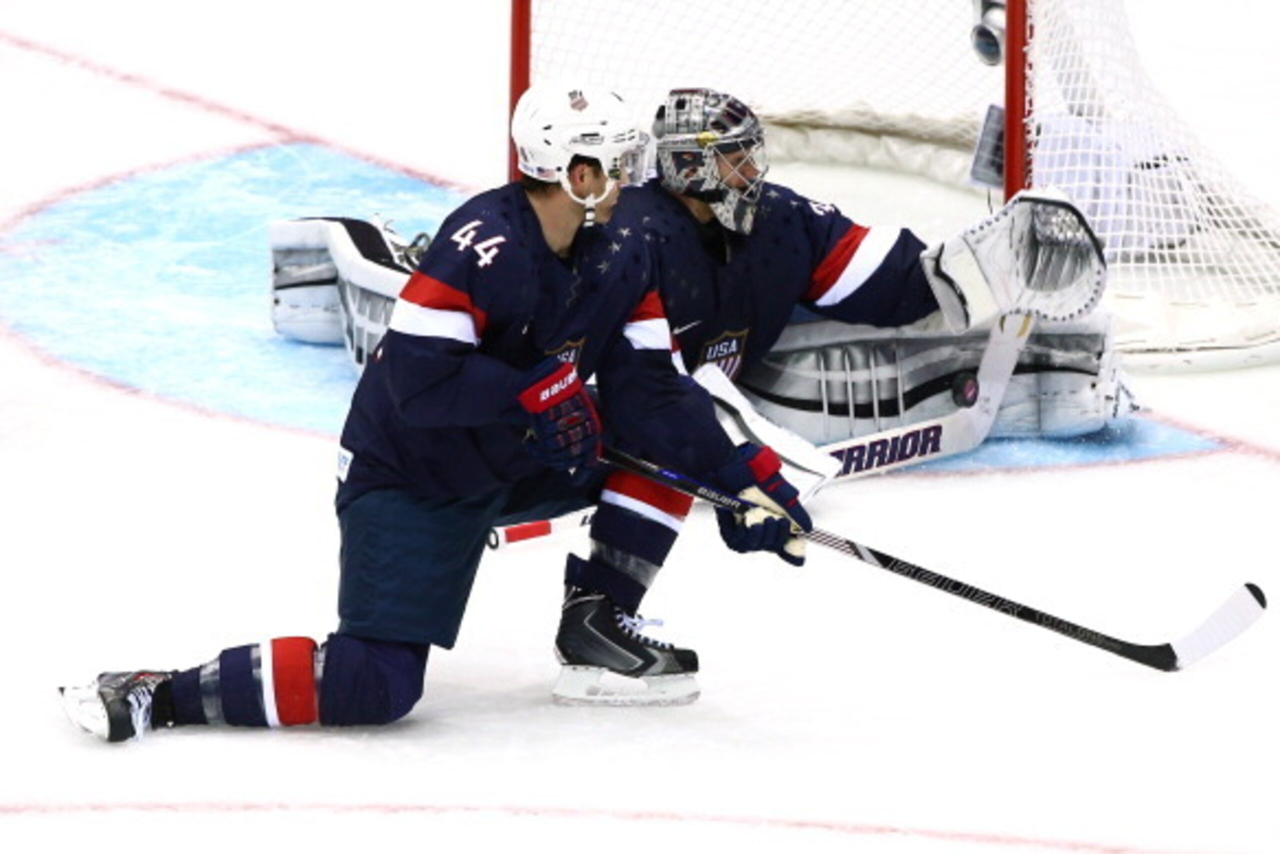 SOCHI, RUSSIA - FEBRUARY 15: Jonathan Quick #32 of the United States makes a save against Russia as teammate Brooks Orpik #44 looks on during the Men's Ice Hockey Preliminary Round Group A game on day eight of the Sochi 2014 Winter Olympics at Bolshoy Ic SOCHI, RUSSIA - FEBRUARY 15: Jonathan Quick #32 of the United States makes a save against Russia as teammate Brooks Orpik #44 looks on during the Men's Ice Hockey Preliminary Round Group A game on day eight of the Sochi 2014 Winter Olympics at Bolshoy Ic