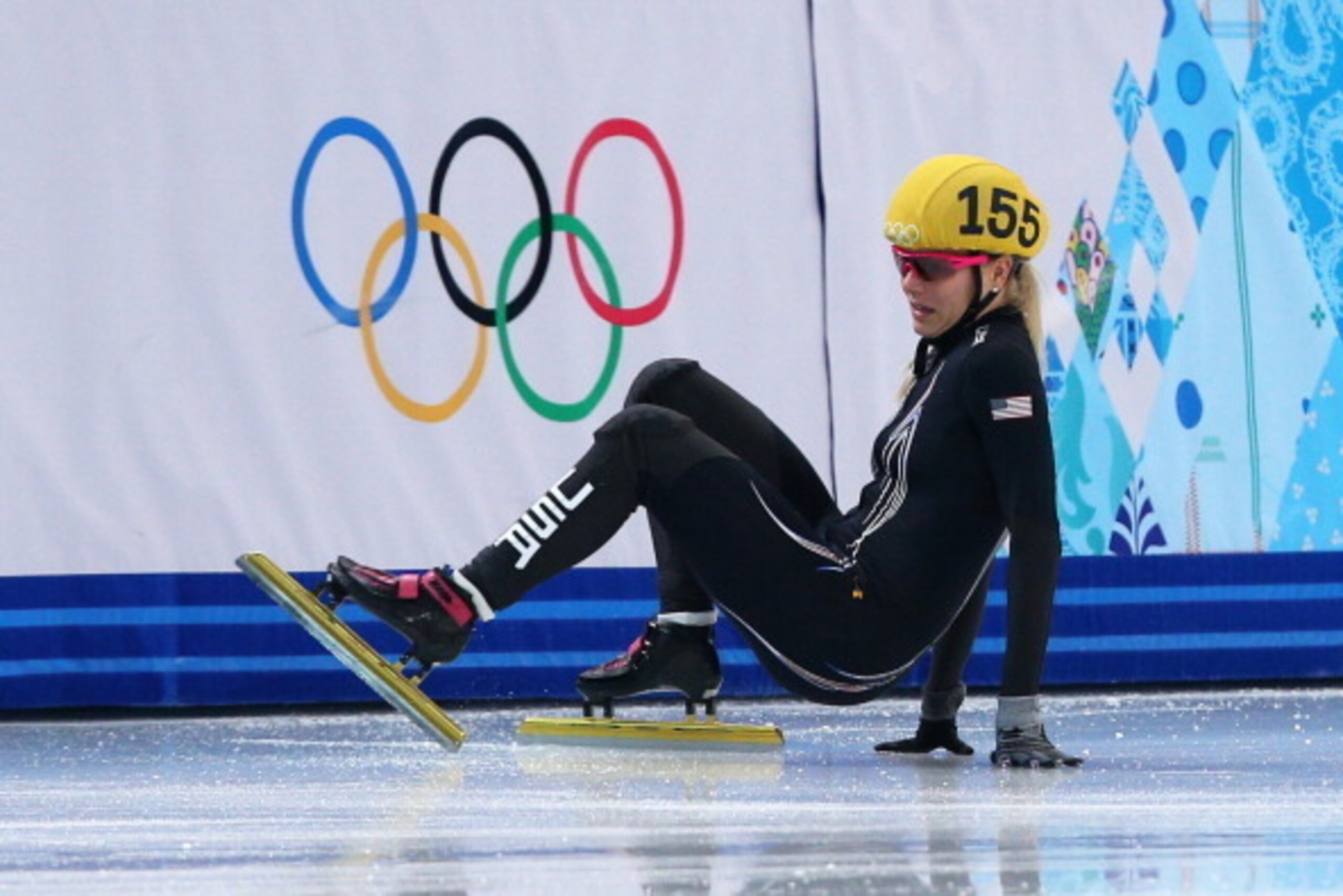 SOCHI, RUSSIA - FEBRUARY 15: Emily Scott of the United States falls during the Ladies' 1500 m Final Short Track Speed Skating on day 8 of the Sochi 2014 Winter Olympics at the Iceberg Skating Palace on February 15, 2014 in Sochi, Russia.  (Photo by Paul G