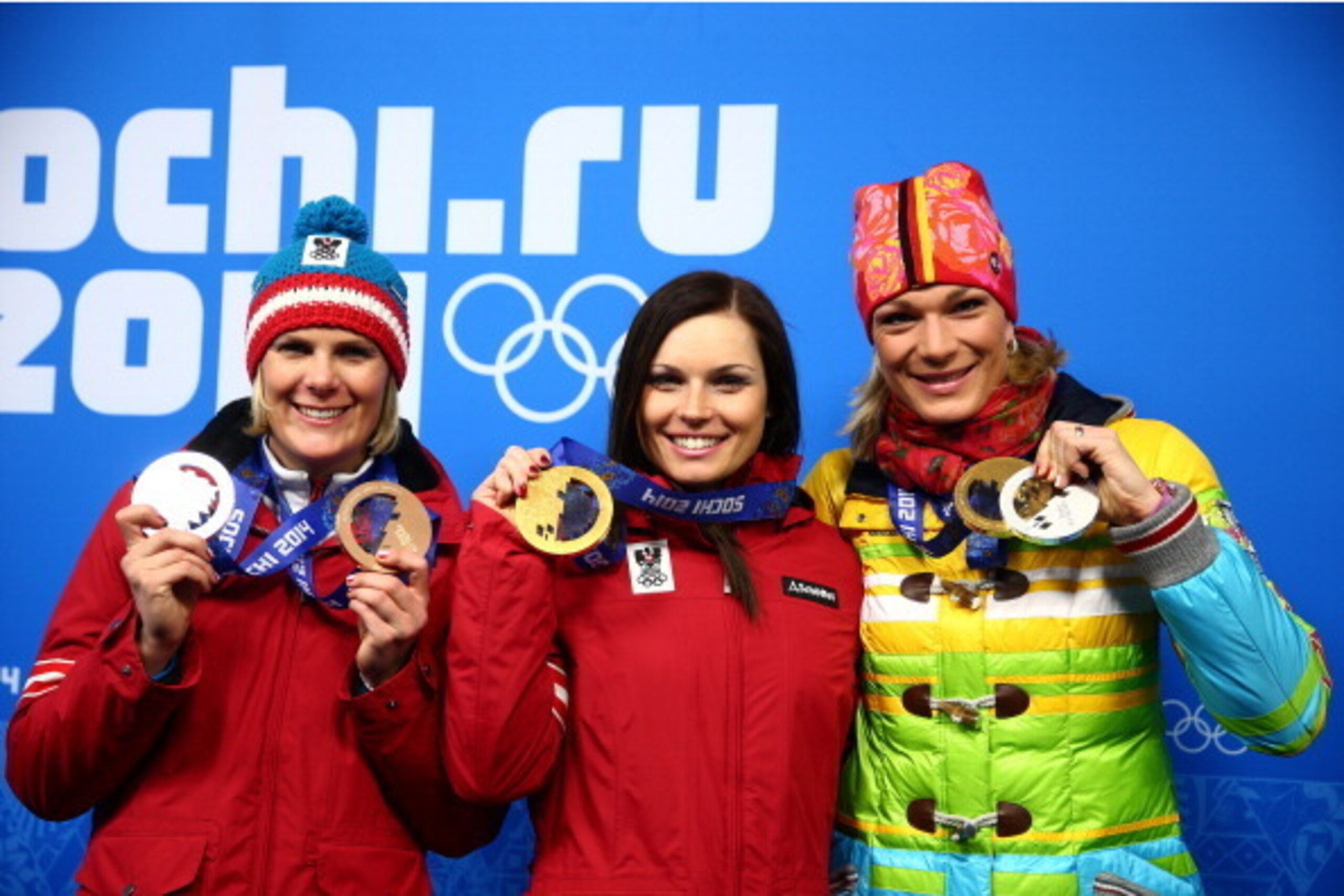 SOCHI, RUSSIA - FEBRUARY 15:  (L-R) Bronze medalist Nicole Hosp of Austria, gold medalist Anna Fenninger of Austria and Silver medalist Maria Hoefl-Riesch of Germany celebrate during the medal ceremony for the Alpine Skiing Ladies' Super-G on day 8 of the