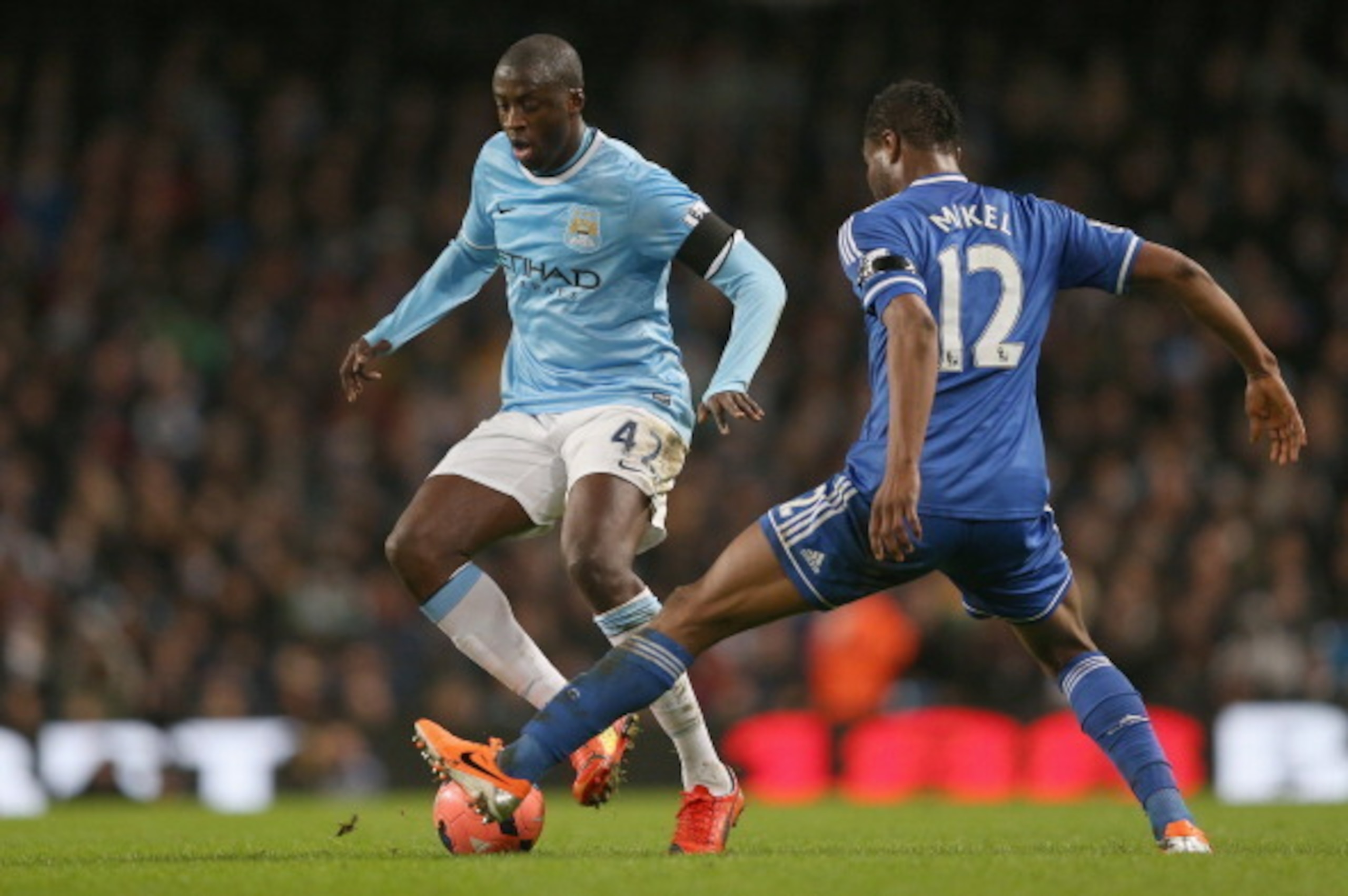MANCHESTER, ENGLAND - FEBRUARY 15:  Yaya Toure of Manchester City attempts to move past a challenge from  John Obi Mikel of Chelsea during the FA Cup Fifth Round match sponsored by Budweiser between Manchester City and Chelsea at Etihad Stadium on Februar