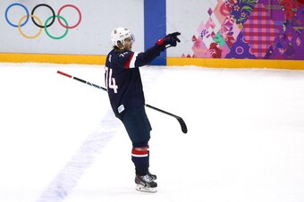 SOCHI, RUSSIA - FEBRUARY 15:  T.J. Oshie #74 of the United States celebrates after scoring on a shootout against Sergei Bobrovski #72 of Russia to win the Men's Ice Hockey Preliminary Round Group A game on day eight of the Sochi 2014 Winter Olympics at Bo