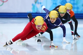 SOCHI, RUSSIA - FEBRUARY 15:  Yang Zhou of China leads the pack on the way to winning the gold medal during the Ladies' 1500 m Final Short Track Speed Skating on day 8 of the Sochi 2014 Winter Olympics at the Iceberg Skating Palace on February 15, 2014 in