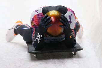 SOCHI, RUSSIA - FEBRUARY 15:  John Daly of the United States dejected after his run during the Men's Skeleton on Day 8 of the Sochi 2014 Winter Olympics at Sliding Center Sanki on February 15, 2014 in Sochi, Russia.  (Photo by Alex Livesey/Getty Images)