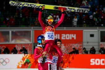 SOCHI, RUSSIA - FEBRUARY 15:  Gold medlaist Kamil Stoch of Poland is lifted on the shoulders of Maciej Kot of Poland and Jan Ziobro of Poland after the Men's Large Hill Individual Final Round on day 8 of the Sochi 2014 Winter Olympics at the RusSki Gorki 