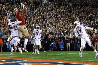 PASADENA, CA - JANUARY 06:  Wide receiver Kelvin Benjamin #1 of the Florida State Seminoles catches a 2-yard pass for a touchdown to take a 33-31 lead in the final moments of the fourth quarter during the 2014 Vizio BCS National Championship Game at the R