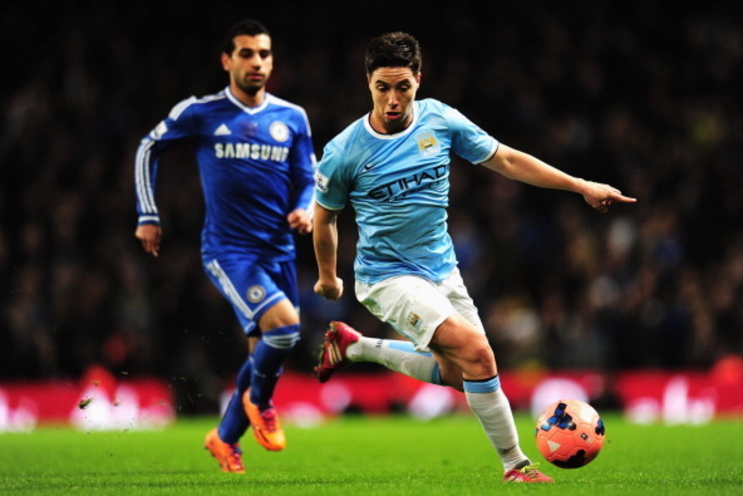 MANCHESTER, ENGLAND - FEBRUARY 15:  Samir Nasri (R) of Manchester City holds off Mohamed Salah (L) of Chelsea during the FA Cup Fifth Round match between Manchester City and Chelsea at the Etihad Stadium on February 15, 2014 in Manchester, England.  (Phot