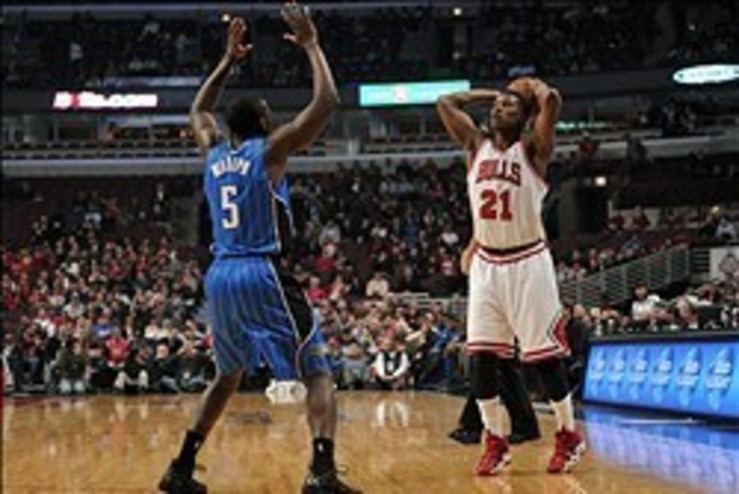 Dec 16, 2013; Chicago, IL, USA; Chicago Bulls shooting guard Jimmy Butler (21) is defended by Orlando Magic shooting guard Victor Oladipo (5) during the first quarter at the United Center. Mandatory Credit: Rob Grabowski-USA TODAY Sports Dec 16, 2013; Chicago, IL, USA; Chicago Bulls shooting guard Jimmy Butler (21) is defended by Orlando Magic shooting guard Victor Oladipo (5) during the first quarter at the United Center. Mandatory Credit: Rob Grabowski-USA TODAY Sports