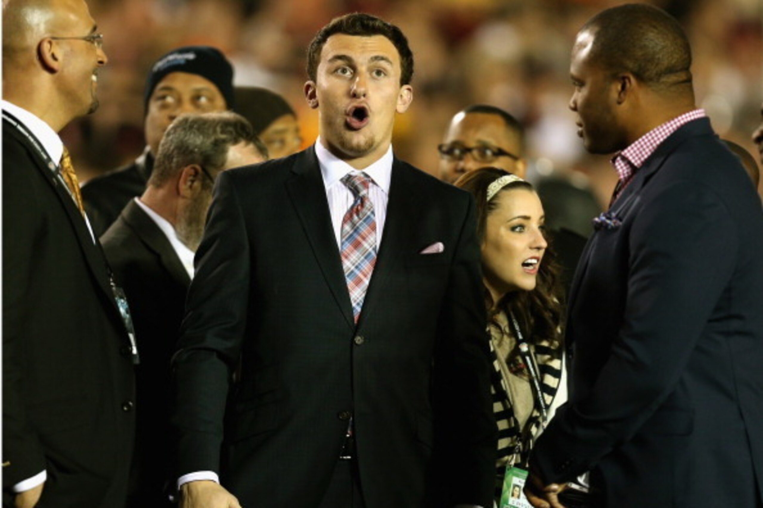 PASADENA, CA - JANUARY 06:  Texas A&M quarterback Johnny Manziel reacts to Levonte Whitfield #7 of the Florida State Seminoles scoring on a 100-yard kickoff return against the Auburn Tigers in the fourth quarter of the 2014 Vizio BCS National Championship