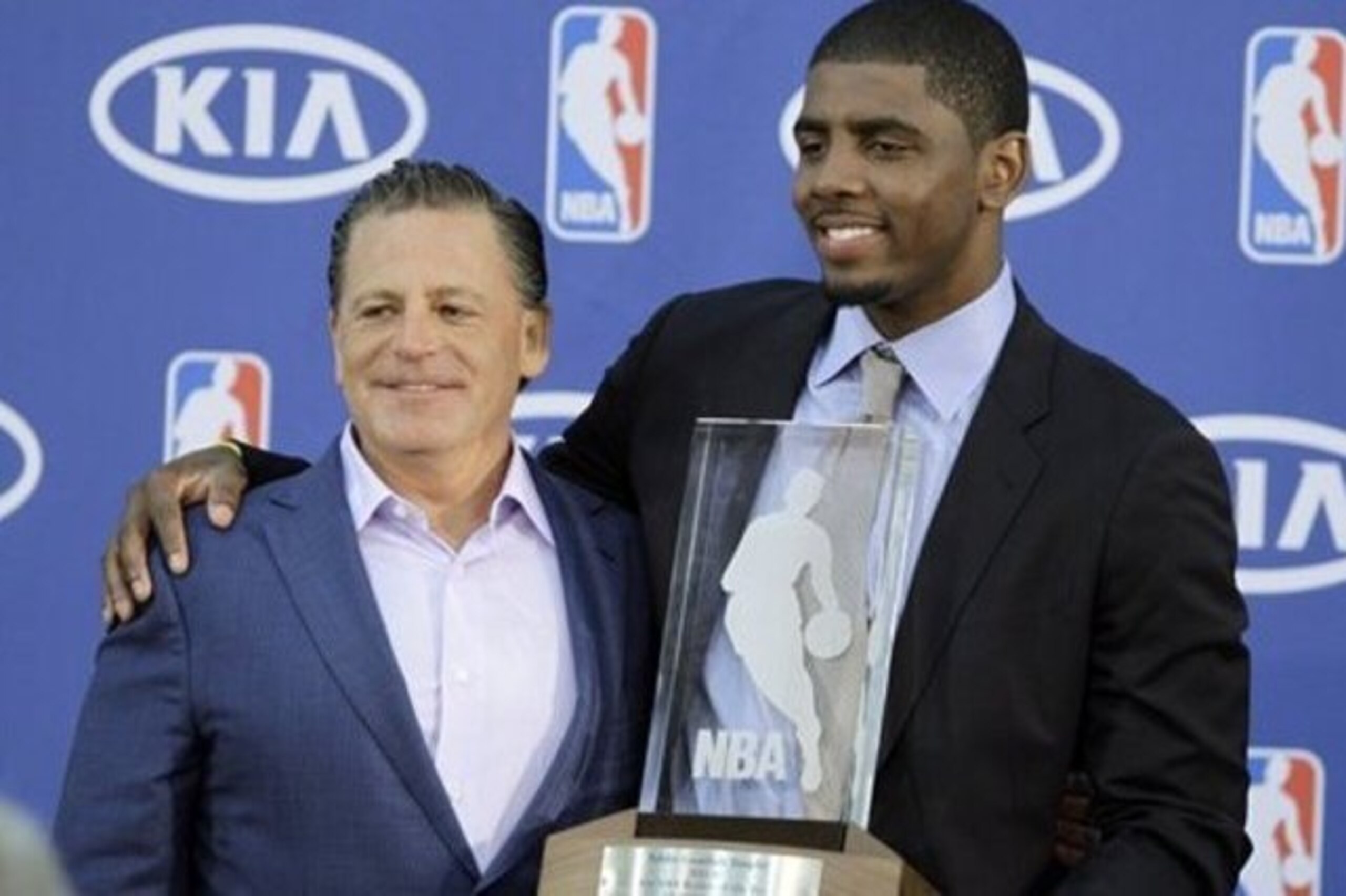Irving with Cavs owner Dan Gilbert (left).