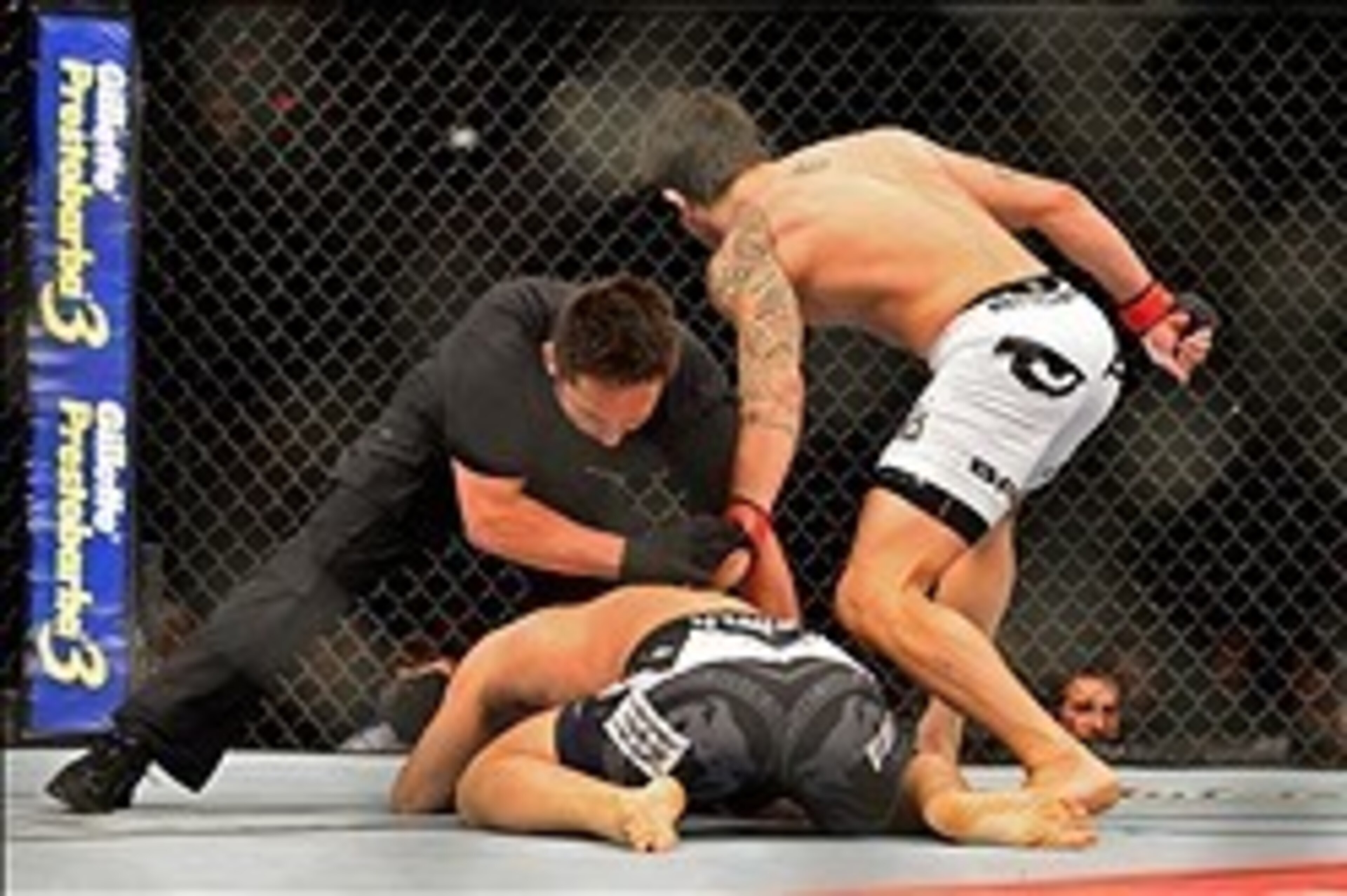 Feb 15, 2014; Jaragua do Sul, SC, Brazil; Erick Silva (red gloves) fights Takenori Sato (blue gloves) during UFC Fight Night Machida vs Mousasi at Arena Jaragua. Mandatory Credit: Jason Silva-USA TODAY Sports