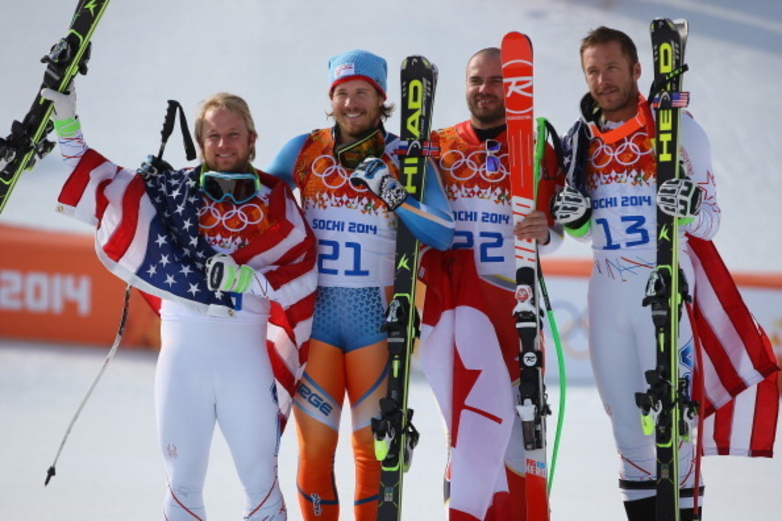 SOCHI, RUSSIA - FEBRUARY 16:  (L-R) Silver medalist Andrew Weibrecht of the United States, gold medalist Kjetil Jansrud of Norway and bronze medalists Jan Hudec of Canada and Bode Miller of the United States celebrate on the podium during the flower cerem
