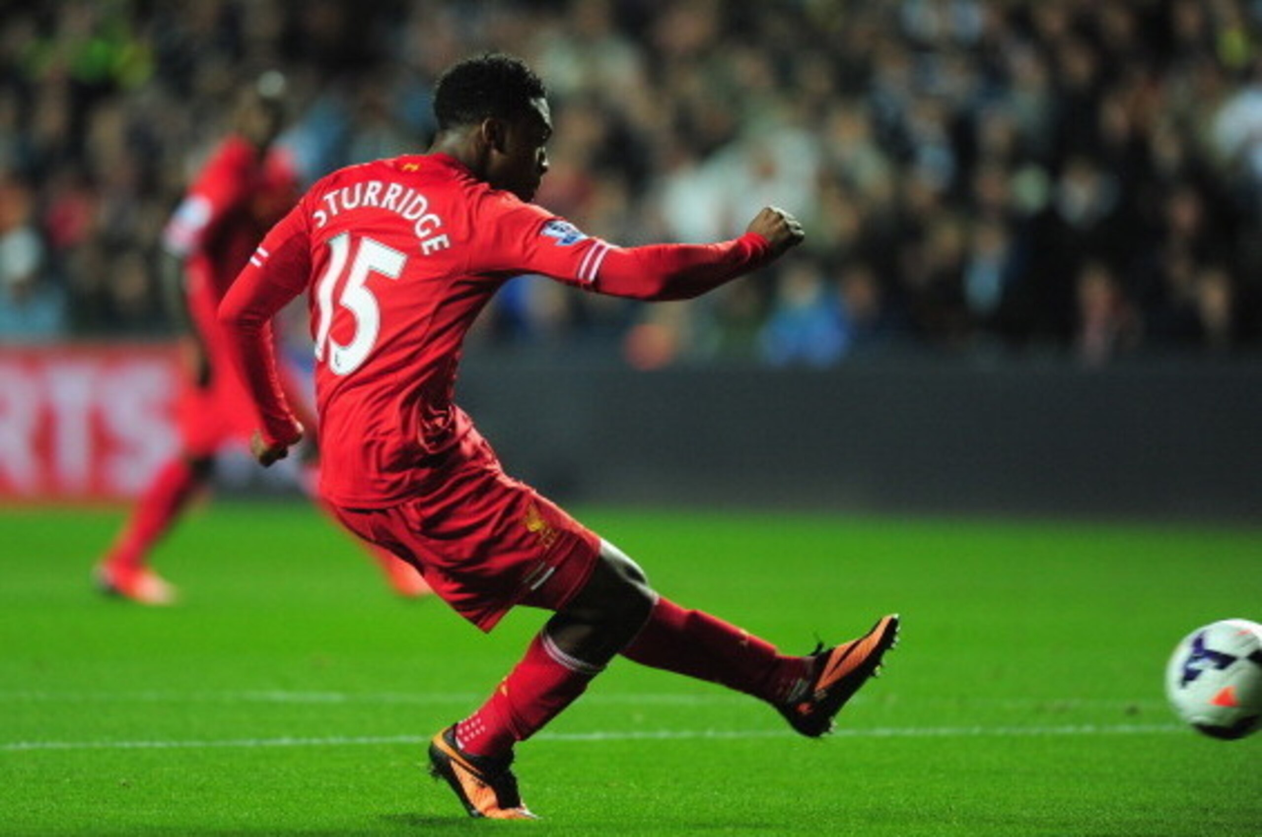 SWANSEA, WALES - SEPTEMBER 16: Liverpool striker Daniel Sturridge scores the first Liverpool goal during the Barclays Premier League match between Swansea City and Liverpool at Liberty Stadium on September 16, 2013 in Swansea, Wales.  (Photo by Stu Forste