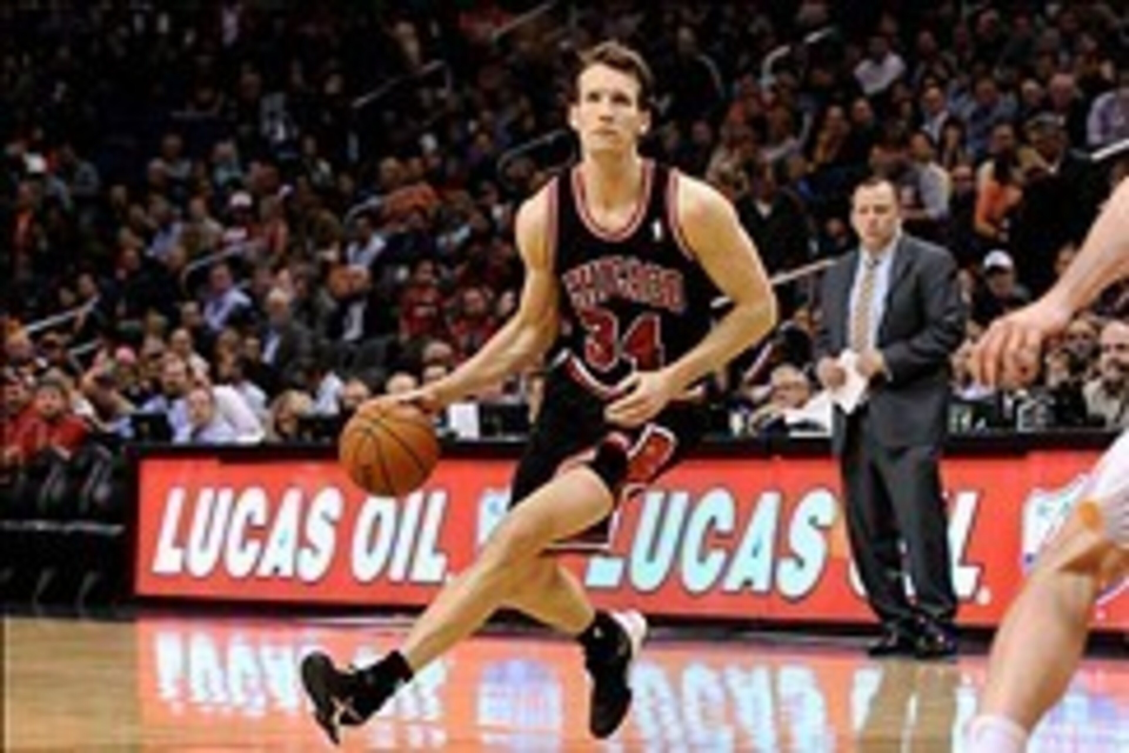 Feb 4, 2014; Phoenix, AZ, USA; Chicago Bulls forward Mike Dunleavy (34) handles the ball against the Phoenix Suns in the first half at US Airways Center. The Bulls won 101-92.  Mandatory Credit: Jennifer Stewart-USA TODAY Sports