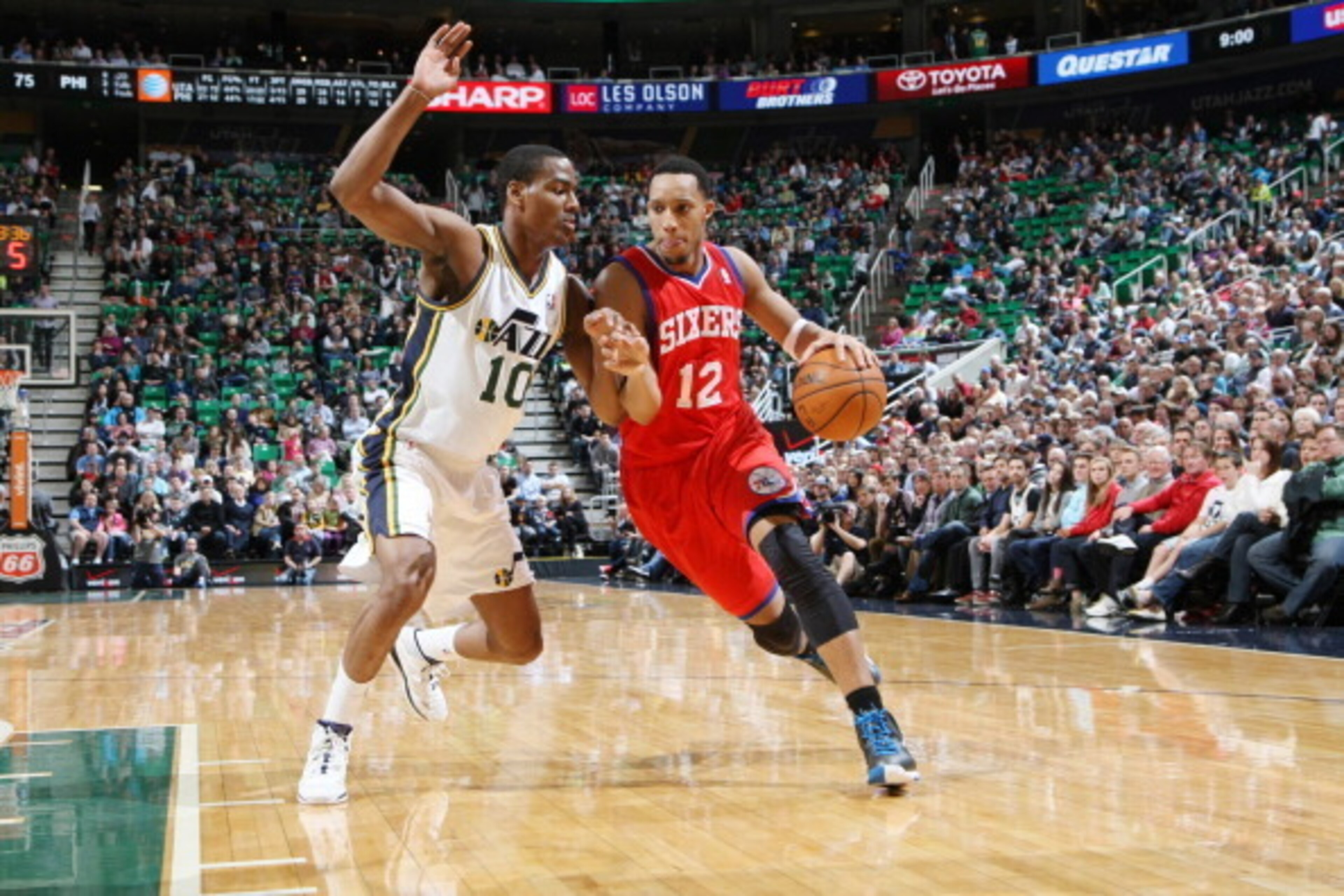 SALT LAKE CITY, UT - FEBRUARY 12:  Evan Turner #12 of the Philadelphia 76ers drives against Alec Burks #10 of the Utah Jazz at EnergySolutions Arena on February 12, 2014 in Salt Lake City, Utah. NOTE TO USER: User expressly acknowledges and agrees that, b