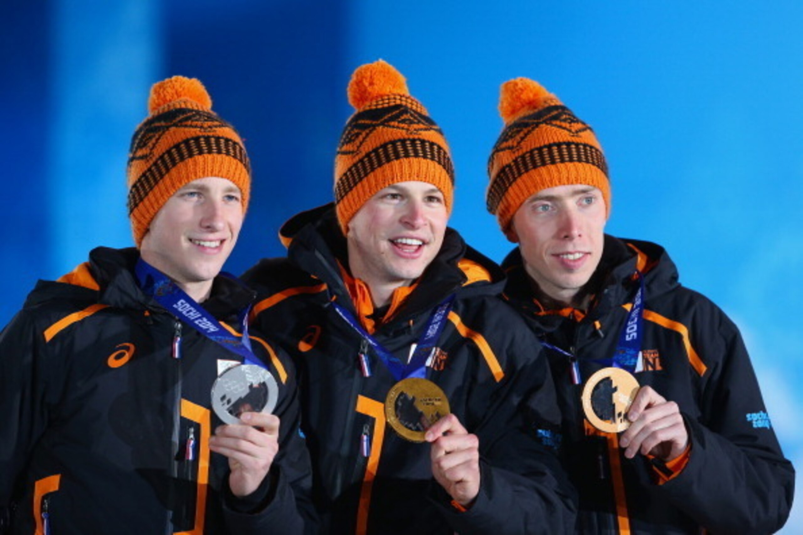 SOCHI, RUSSIA - FEBRUARY 09:  (L-R) Silver medalist Jan Blokhuijsen of the Netherlands, gold medalist Sven Kramer of the Netherlands and bronze medalist Jorrit Bergsma of the Netherlands celebrate during the medal ceremony for the Men's 5000m Speed Skatin