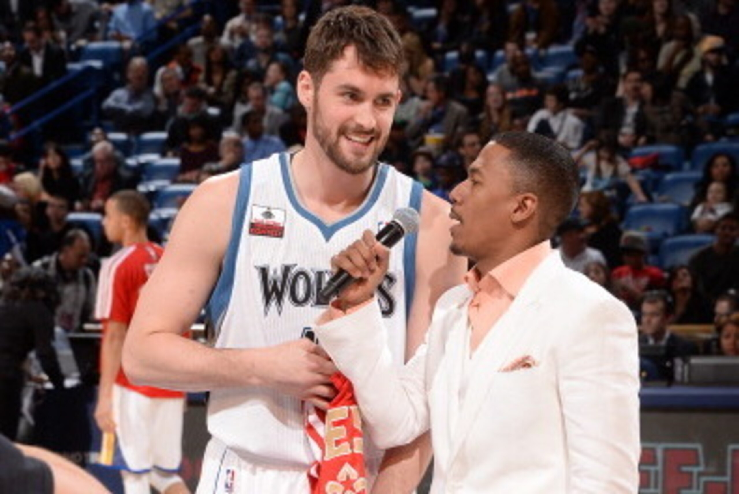 NEW ORLEANS, LA - FEBRUARY 15: Nick Cannon Speaks to Kevin Love #42 of the Minnesota Timberwolves during the Foot Locker Three-Point Contest on State Farm All-Star Saturday Night as part of the 2014 All-Star Weekend at Smoothie King Center on February 15,