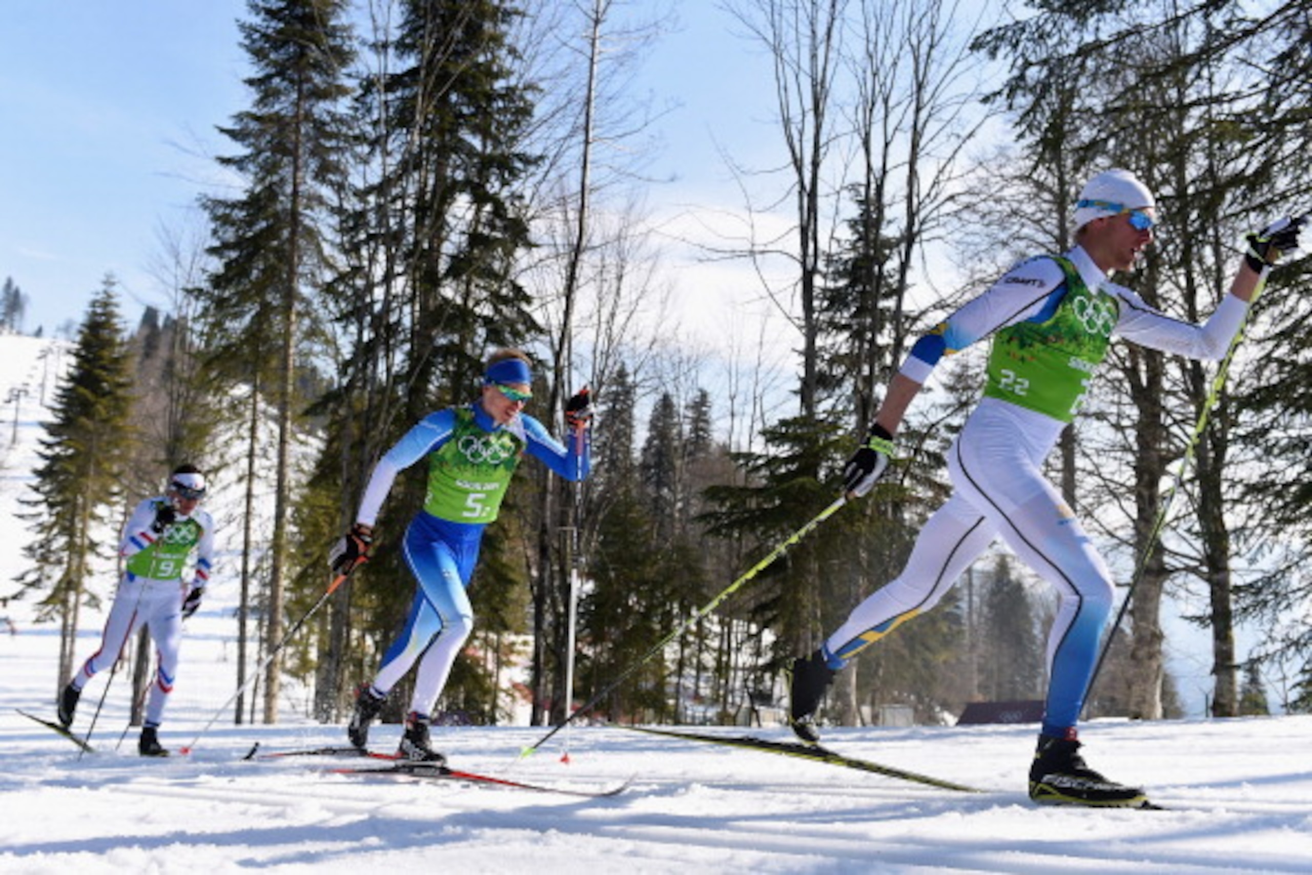 SOCHI, RUSSIA - FEBRUARY 16:  Daniel Richardsson (R) of Sweden, Iivo Niskanen (C) of Finland and Maurice Manificat (L) of France compete on the second leg of the Cross Country Men's 4 x 10 km Relay during day nine of the Sochi 2014 Winter Olympics at Laur