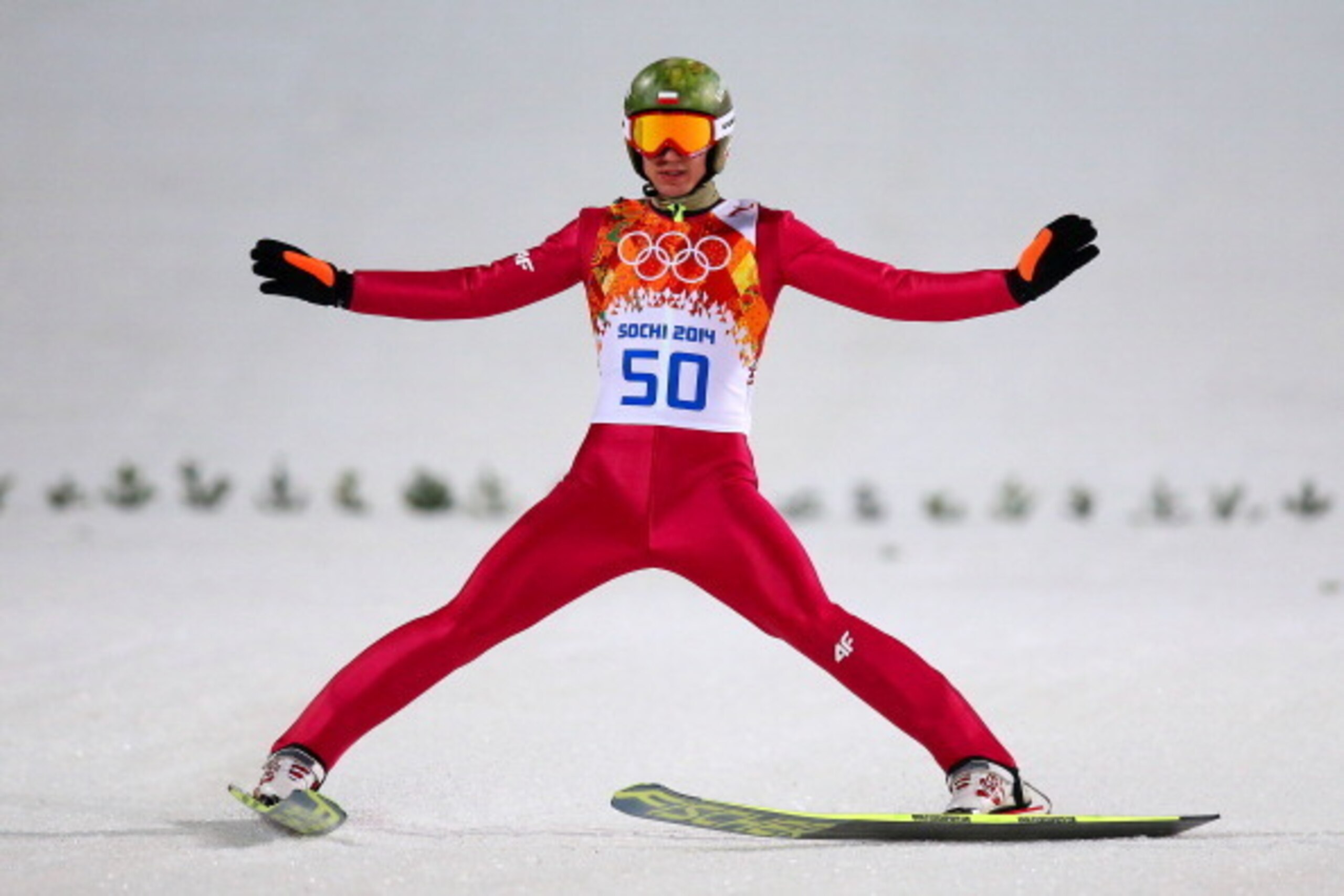 SOCHI, RUSSIA - FEBRUARY 15:  Kamil Stoch of Poland lands his jump during the Men's Large Hill Individual Final Round on day 8 of the Sochi 2014 Winter Olympics at the RusSki Gorki Ski Jumping Center on February 15, 2014 in Sochi, Russia.  (Photo by Julia