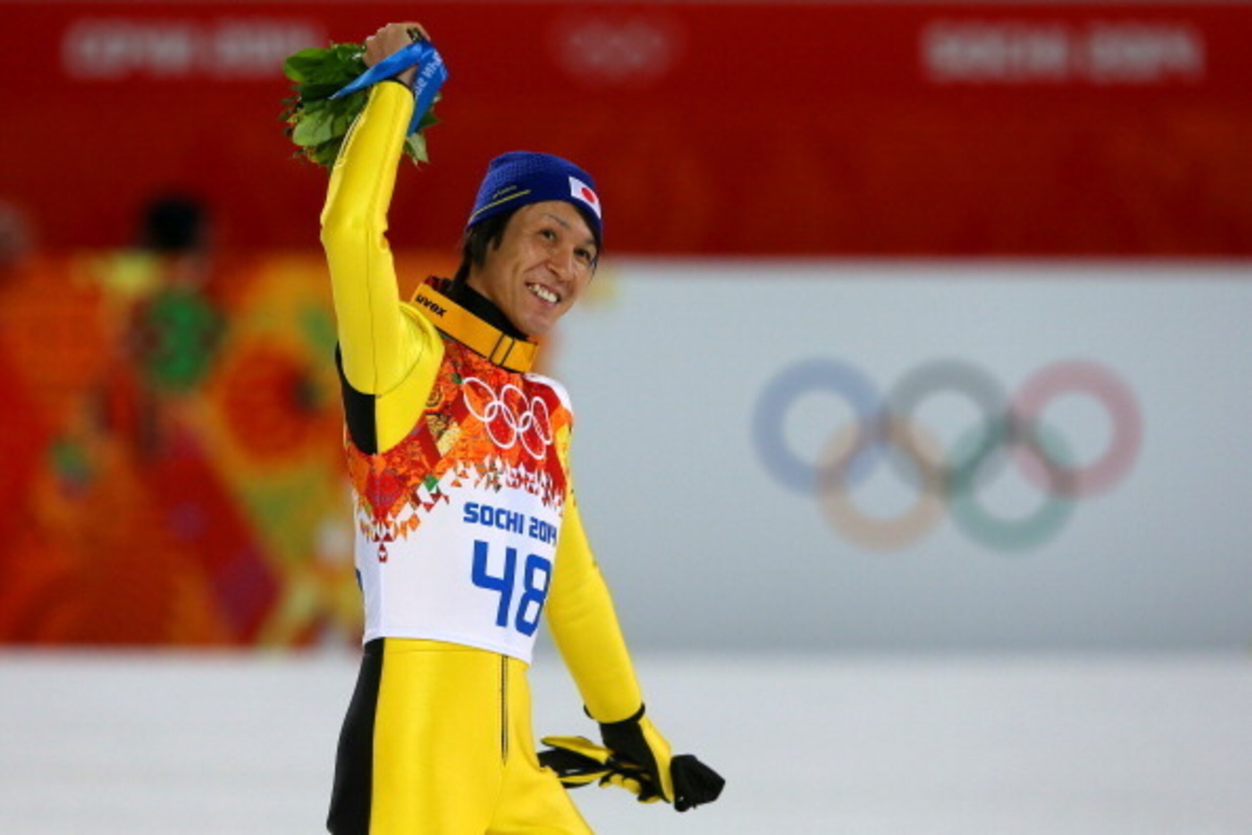 SOCHI, RUSSIA - FEBRUARY 15:  Silver medalist Noriaki Kasai of Japan celebrates after the flower ceremony after the Men's Large Hill Individual Final Round on day 8 of the Sochi 2014 Winter Olympics at the RusSki Gorki Ski Jumping Center on February 15, 2