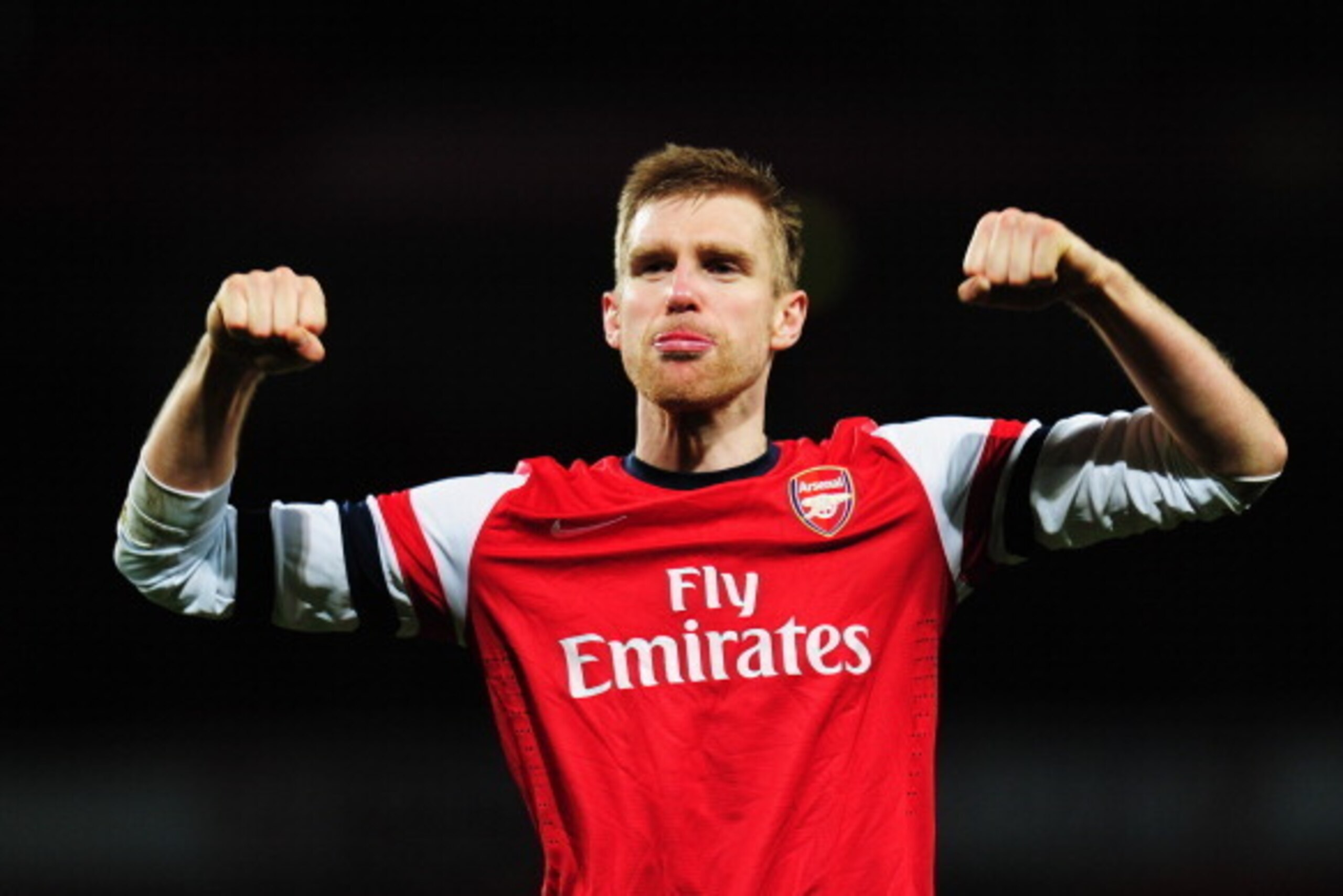 LONDON, ENGLAND - FEBRUARY 16:  Per Mertesacker of Arsenal celebrates at the end of the FA Cup Fifth Round match between Arsenal and Liverpool at the Emirates Stadium on February 16, 2014 in London, England.  (Photo by Shaun Botterill/Getty Images)