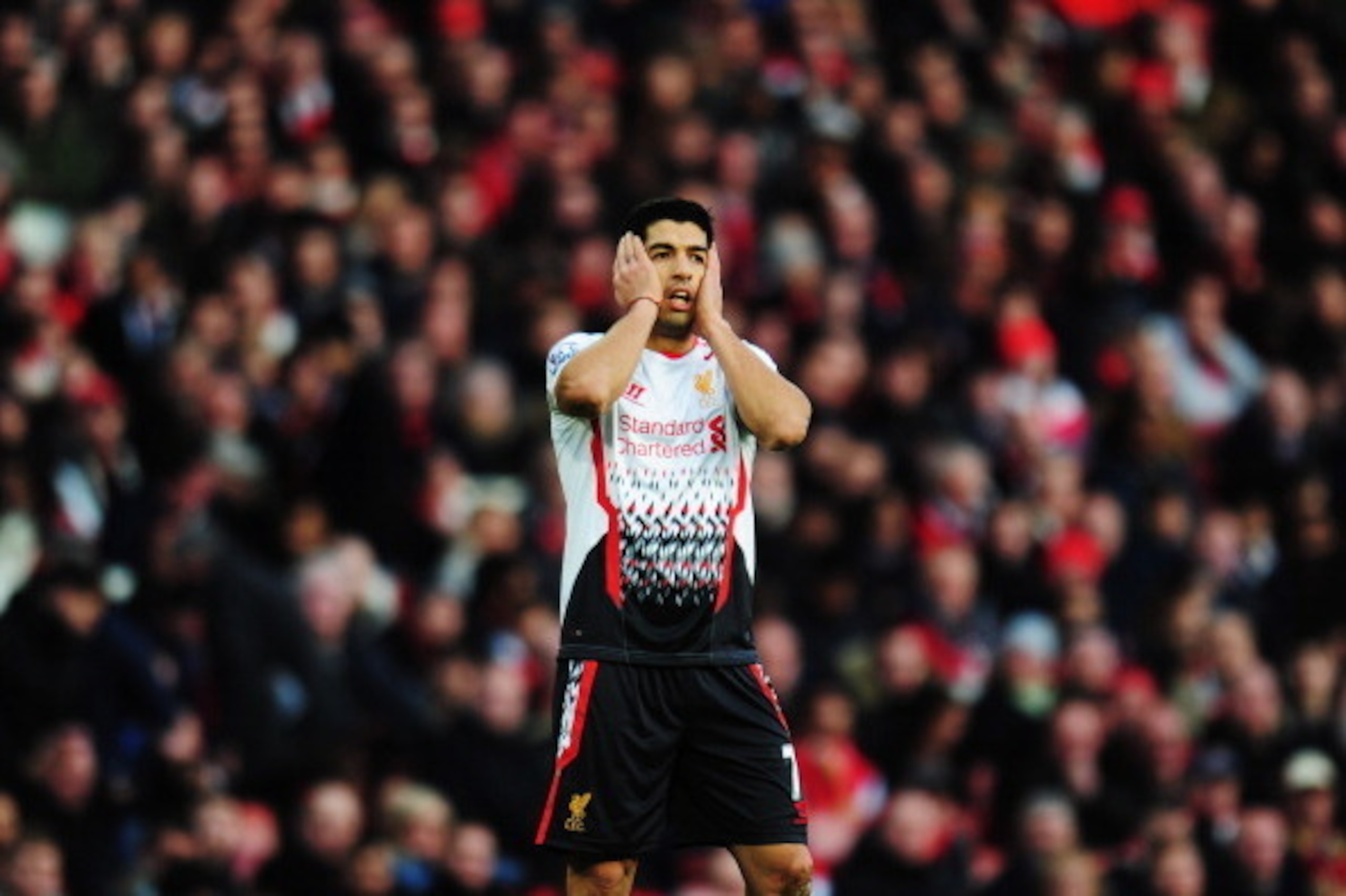 LONDON, ENGLAND - FEBRUARY 16:  Luis Suarez of Liverpool reacts during the FA Cup Fifth Round match between Arsenal and Liverpool at the Emirates Stadium on February 16, 2014 in London, England.  (Photo by Shaun Botterill/Getty Images)