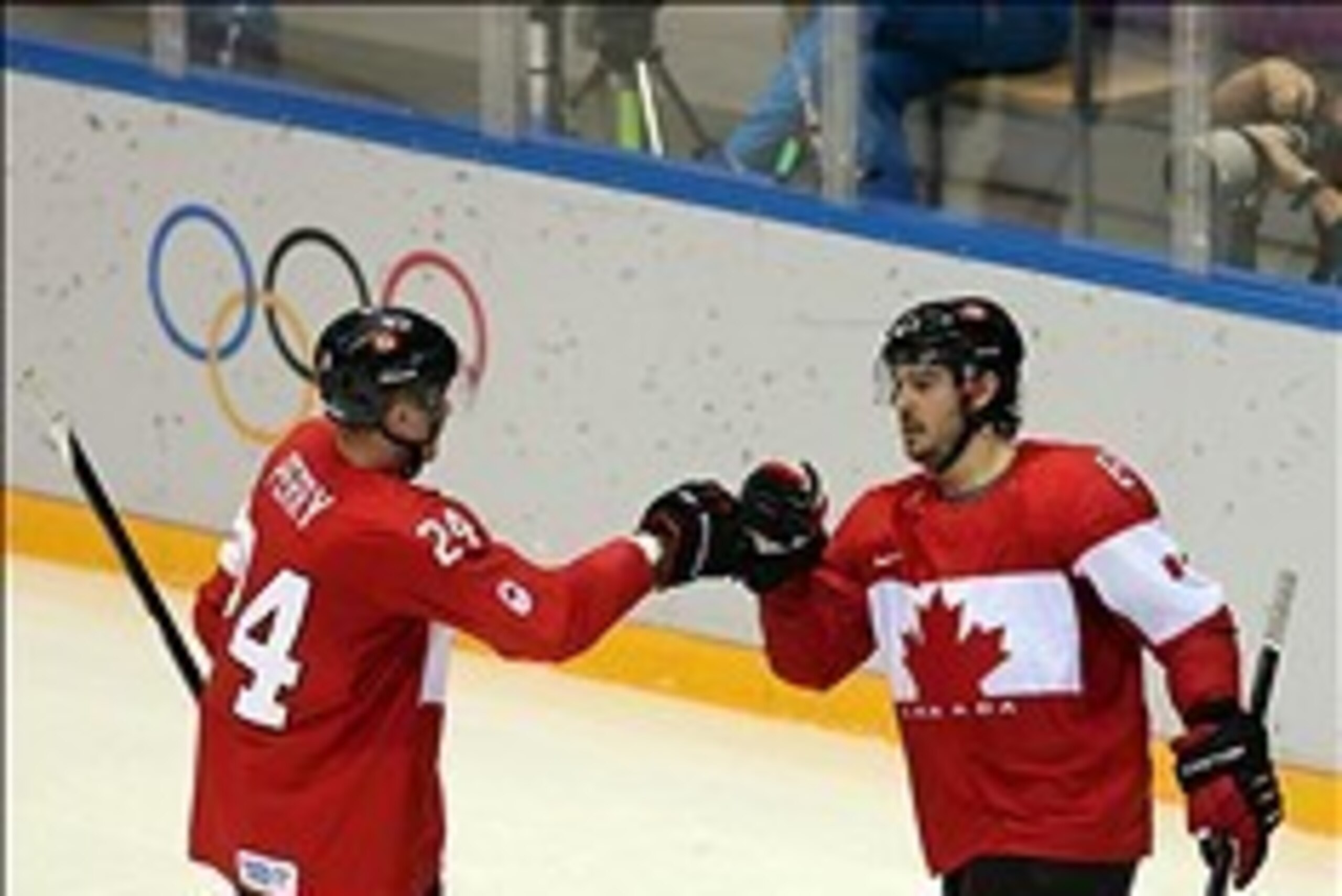 Feb 13, 2014; Sochi, RUSSIA; Canada defenseman Drew Doughty (8) celebrates with forward Corey Perry (24) after scoring a goal against Norway in a men's ice hockey preliminary round game during the Sochi 2014 Olympic Winter Games at Bolshoy Ice Dome. Manda