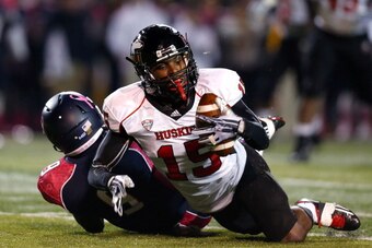 TOLEDO, OH - NOVEMBER 20:  Jimmie Ward #15 of the Northern Illinois Huskies intercepts a pass intended for Alonzo Russell #9 of the Toledo Rockets during the first quarter on November 20, 2013 at the Glass Bowl in Toledo, Ohio. (Photo by Kirk Irwin/Getty 