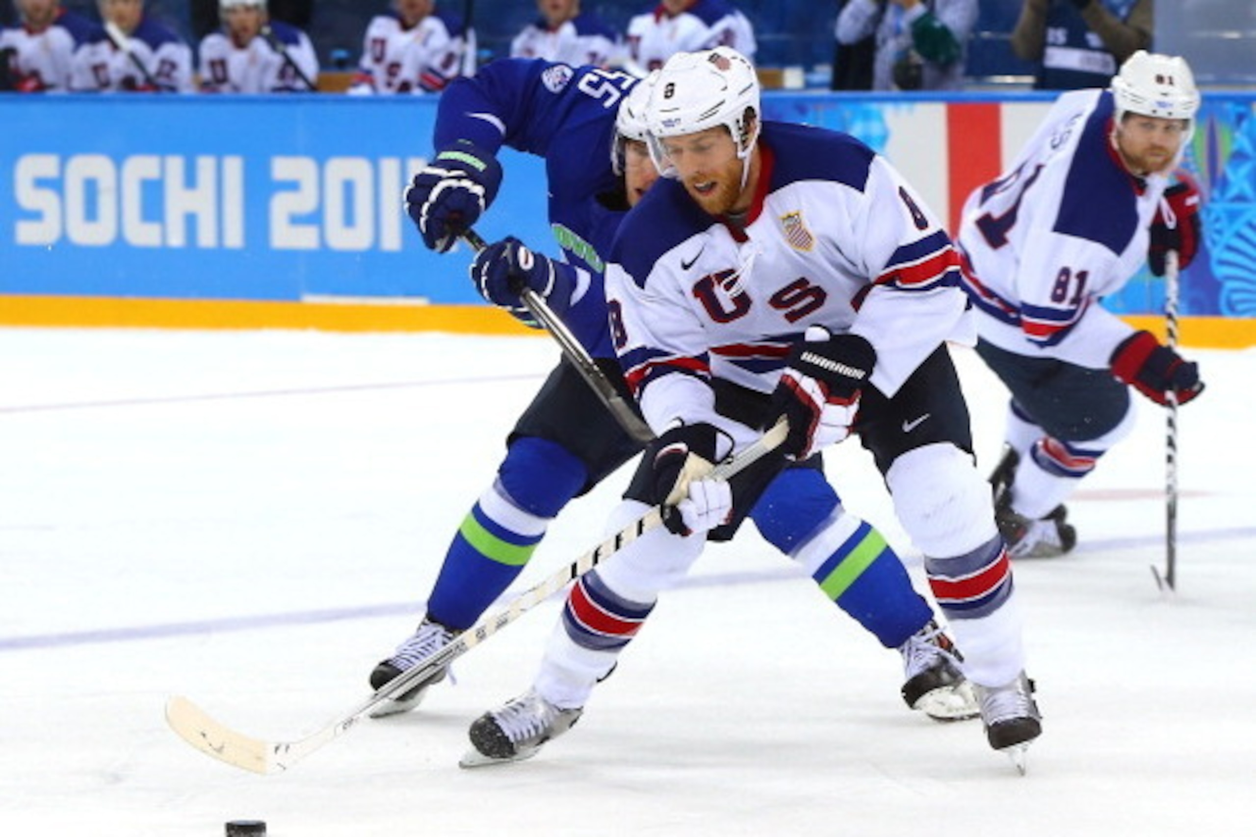 SOCHI, RUSSIA - FEBRUARY 16: Joe Pavelski #8 of the United States handles the puck against Robet Sabolic #55 of Slovenia in the third period during the Men's Ice Hockey Preliminary Round Group A game on day nine of the Sochi 2014 Winter Olympics at Shayba SOCHI, RUSSIA - FEBRUARY 16: Joe Pavelski #8 of the United States handles the puck against Robet Sabolic #55 of Slovenia in the third period during the Men's Ice Hockey Preliminary Round Group A game on day nine of the Sochi 2014 Winter Olympics at Shayba