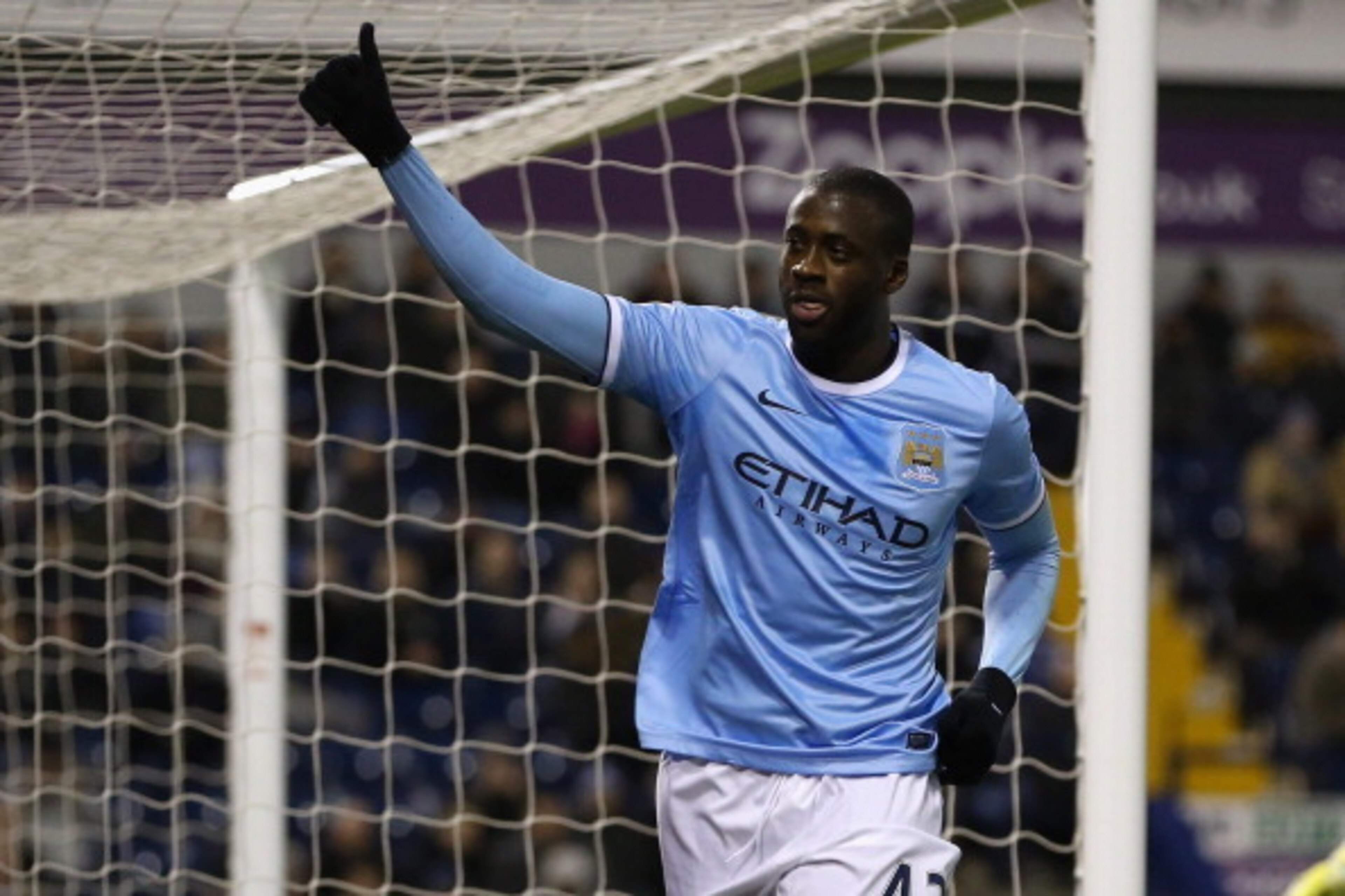 WEST BROMWICH, ENGLAND - DECEMBER 04:  Yaya Toure of Manchester City celebrates after scoring his second goal during the Premier League match between West Bromwich Albion and Manchester City at The Hawthorns on December 4, 2013 in West Bromwich, England. 