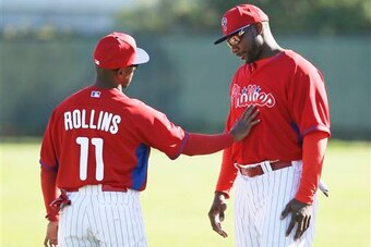 A slimmed-down Ryan Howard talks to Jimmy Rollins during Spring Training.