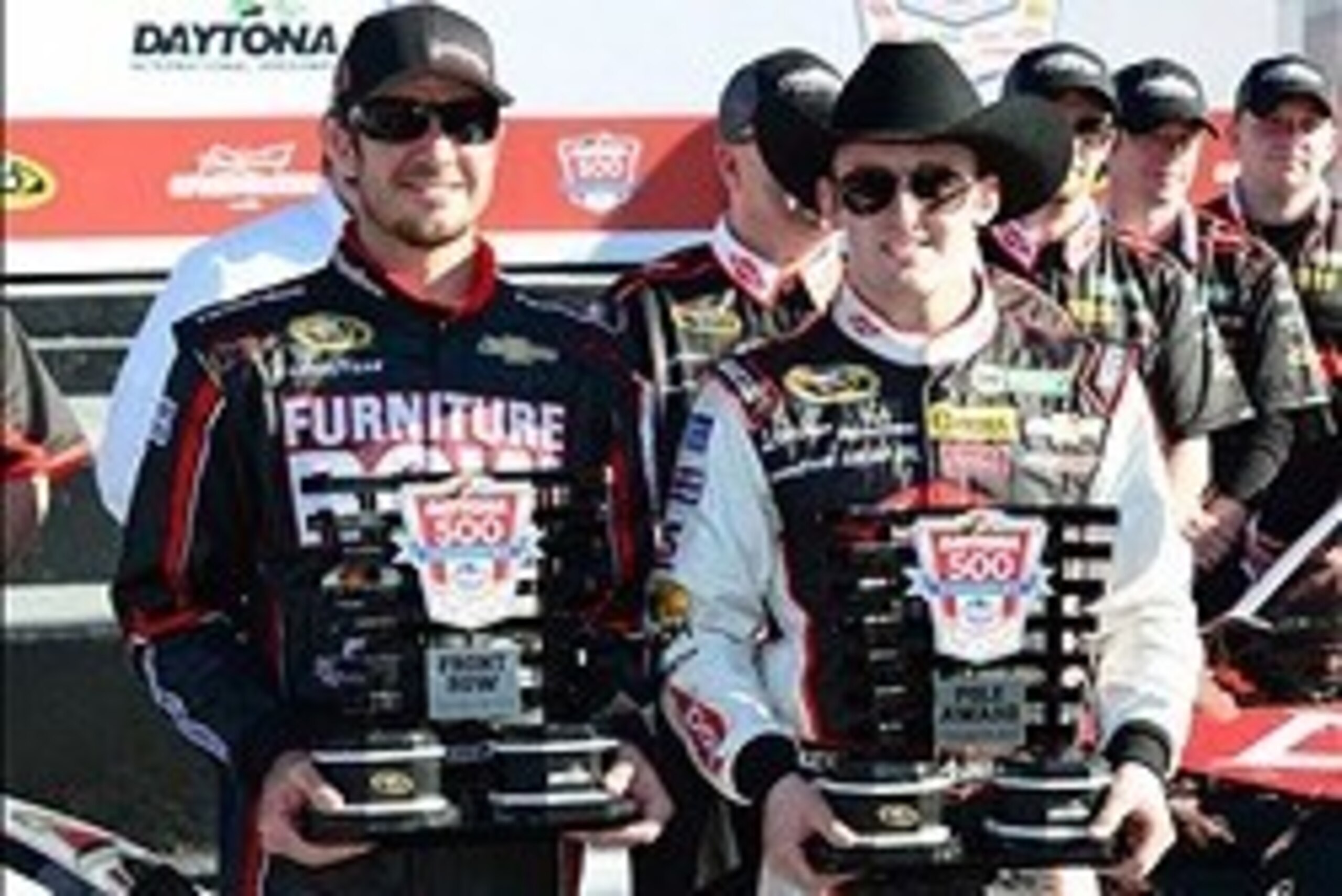 Feb 16, 2014; Daytona Beach, FL, USA; NASCAR Sprint Cup Series driver Austin Dillon (R) and Martin Truex Jr. (L) celebrate starting on the front row for the Daytona 500 at Daytona International Speedway. Mandatory Credit: Jasen Vinlove-USA TODAY Sports
