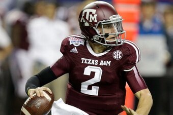 ATLANTA, GA - DECEMBER 31:  Quarterback Johnny Manziel #2 of the Texas A&M Aggies rolls out and looks downfield to pass during the the Chick-fil-A Bowl game against the Duke Blue Devils at the Georgia Dome on December 31, 2013 in Atlanta, Georgia.  (Photo