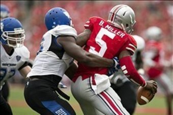 Aug 31, 2013; Columbus, OH, USA; Buffalo Bulls linebacker Khalil Mack (46) tackles Ohio State Buckeyes quarterback Braxton Miller (5) at Ohio Stadium. Ohio State won the game 40-20. Mandatory Credit: Greg Bartram-USA TODAY Sports