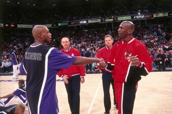 SACRAMENTO, CA - FEBRUARY 1: Michael Jordan #23 of the Chicago Bulls greets Mitch Richmond #2  of the Sacramento Kings on February 1, 1996 at Arco Arena in Sacramento, California. NOTE TO USER: User expressly acknowledges and agrees that, by downloading a
