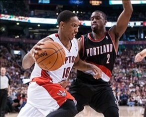 Nov 17, 2013; Toronto, Ontario, CAN;Toronto Raptors shooting guard DeMar DeRozan (10) drives the ball on the baseline with Portland Trail Blazers shooting guard Wesley Matthews (2) defending during the fourth quarter of a game at the Air Canada Centre. Po