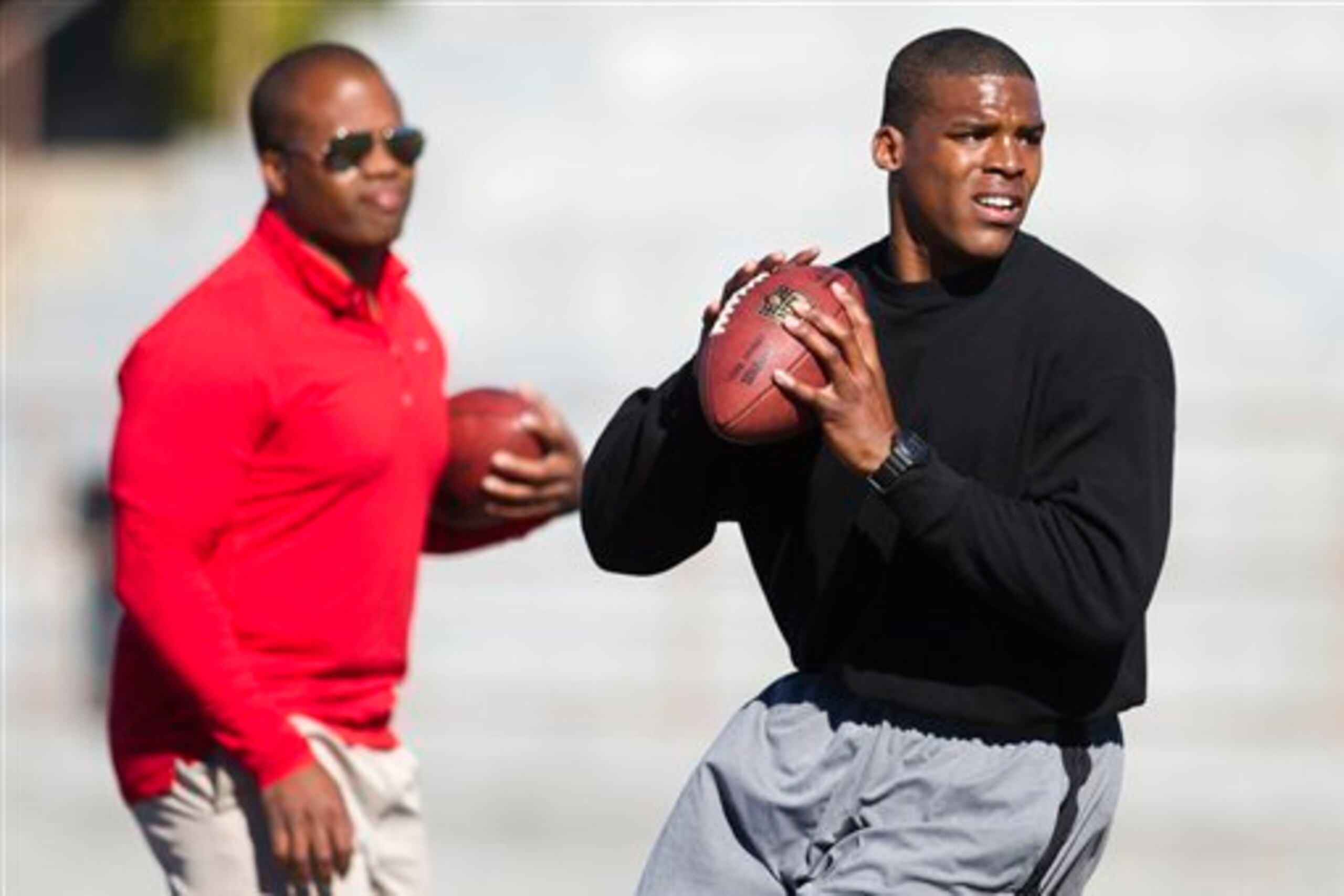 The client list of quarterback coach George Whitfield Jr. (left) includes Cam Newton (right), Johnny Manziel, Andrew Luck and now Everett Golson.