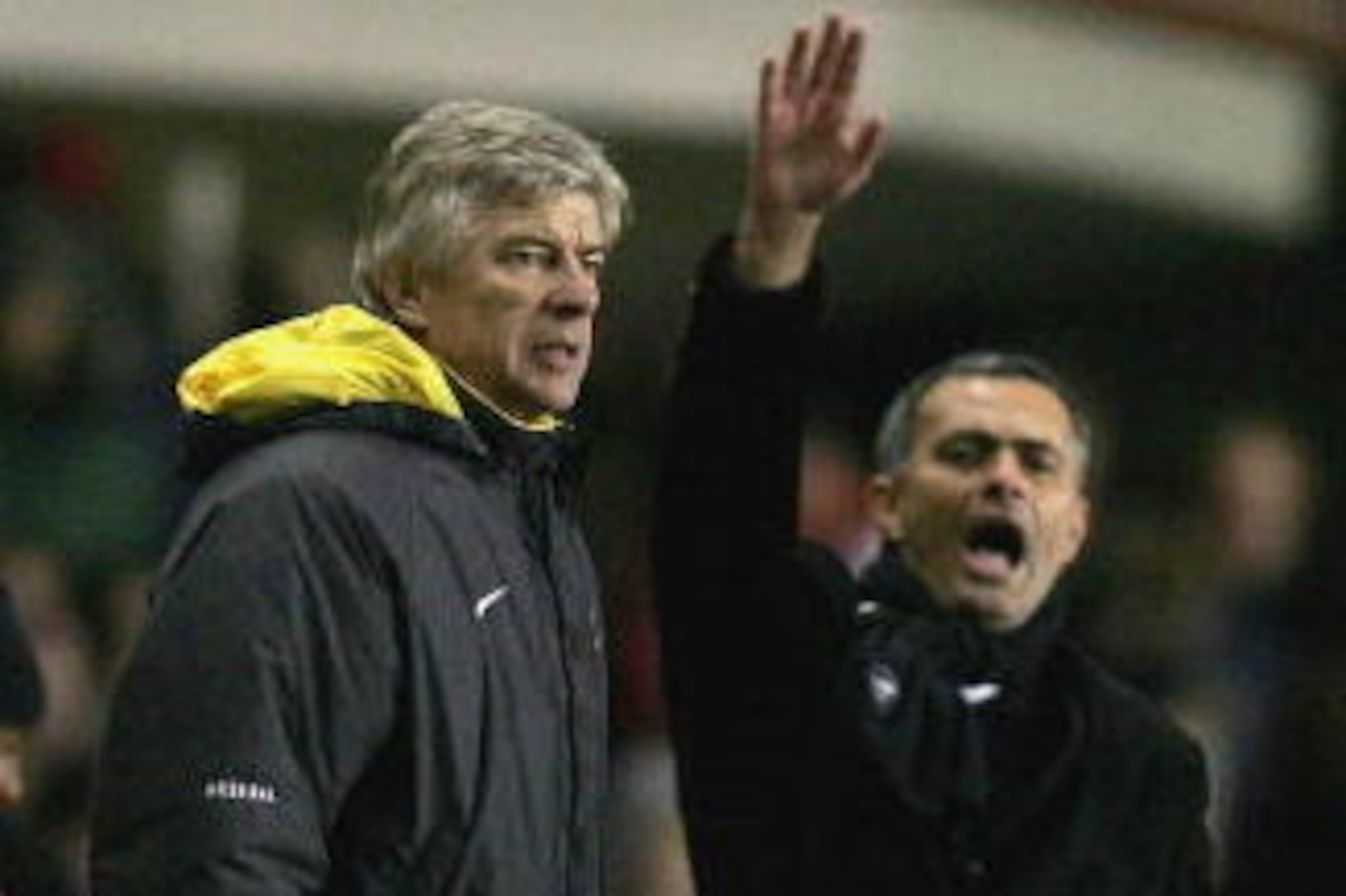 LONDON - DECEMBER 18:  Arsenal Manager Arsene Wenger (L) and Chelsea Manager Jose Mourinho (R) give instructions from the sidelines during the Barclays Premiership match between Arsenal and Chelsea at Highbury on December 18, 2005 in London, England.  (Ph