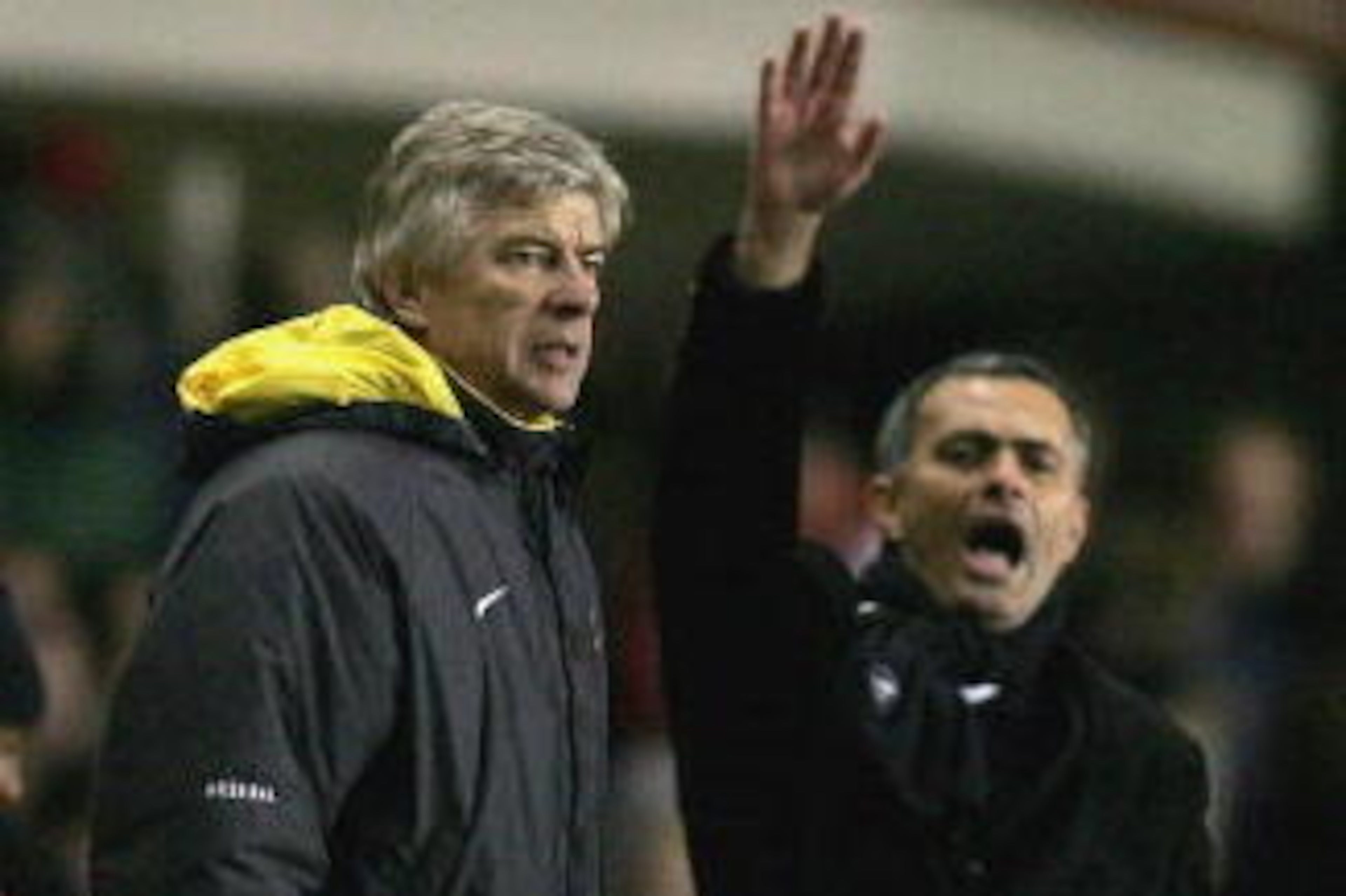 LONDON - DECEMBER 18:  Arsenal Manager Arsene Wenger (L) and Chelsea Manager Jose Mourinho (R) give instructions from the sidelines during the Barclays Premiership match between Arsenal and Chelsea at Highbury on December 18, 2005 in London, England.  (Ph