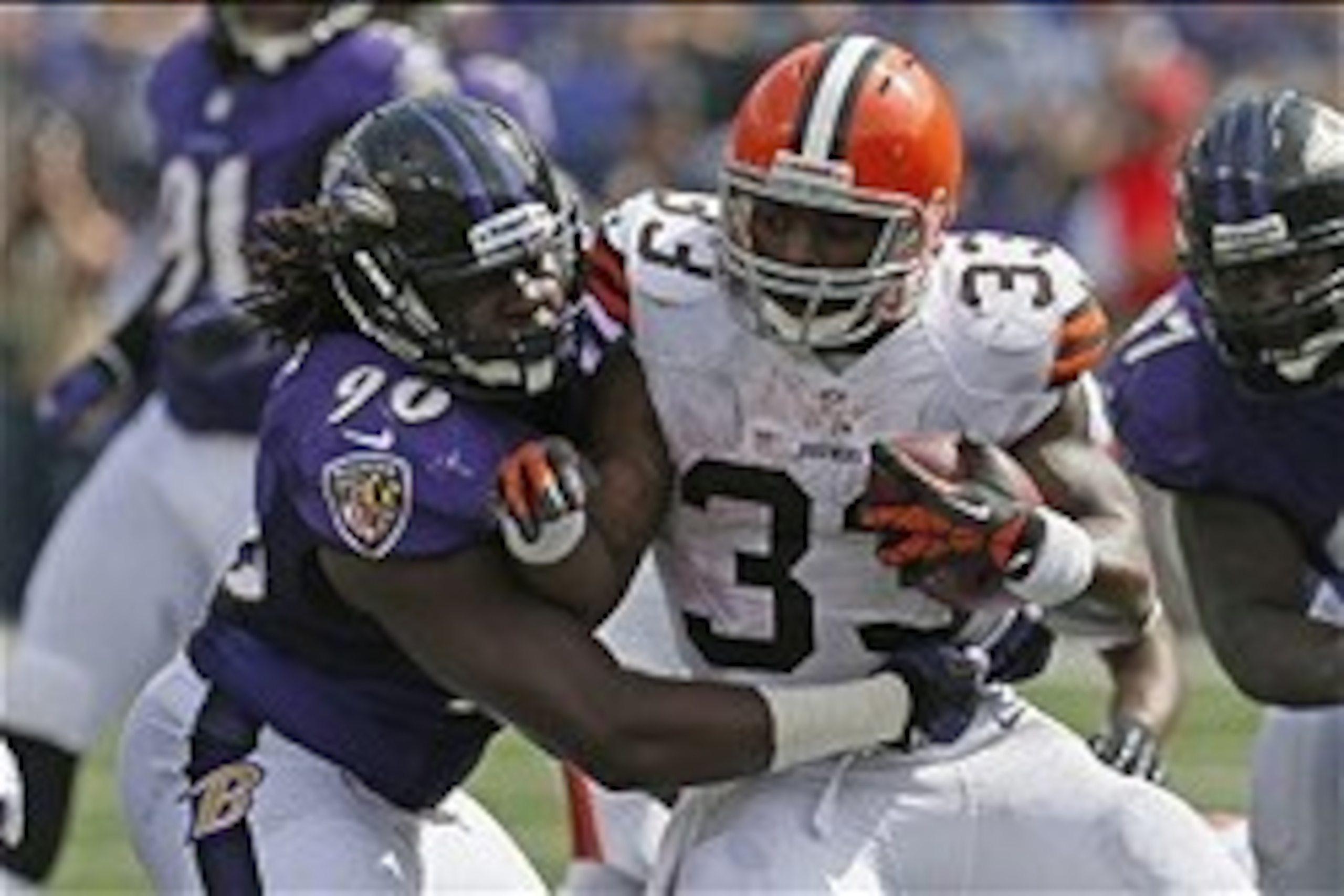 Sep 15, 2013; Baltimore, MD, USA; Cleveland Browns running back Trent Richardson (33) tackled by Baltimore Ravens linebacker Pernell McPhee (90) at M&T Bank Stadium. Mandatory Credit: Mitch Stringer-USA TODAY Sports Sep 15, 2013; Baltimore, MD, USA; Cleveland Browns running back Trent Richardson (33) tackled by Baltimore Ravens linebacker Pernell McPhee (90) at M&T Bank Stadium. Mandatory Credit: Mitch Stringer-USA TODAY Sports